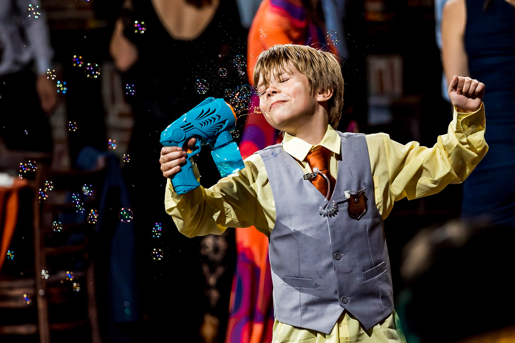 Fun, colorful, nerdy wedding with a dog ringbearer and bubble guns at Mile High Station in Denver, CO