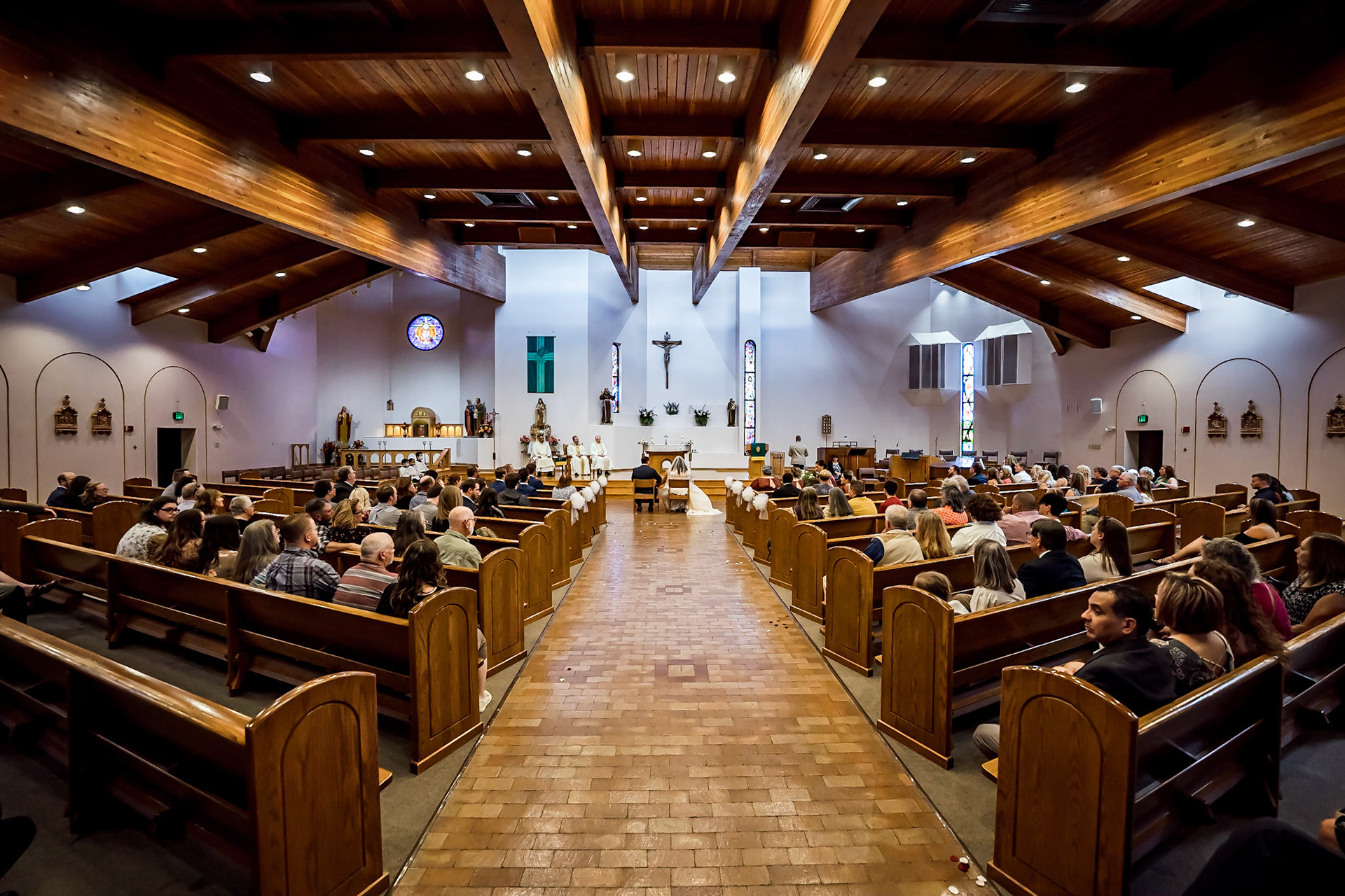 Bright and colorful wedding photography from a gorgeous Catholic Wedding Ceremony and the Sangre de Cristo Arts center in Pueblo Colorado