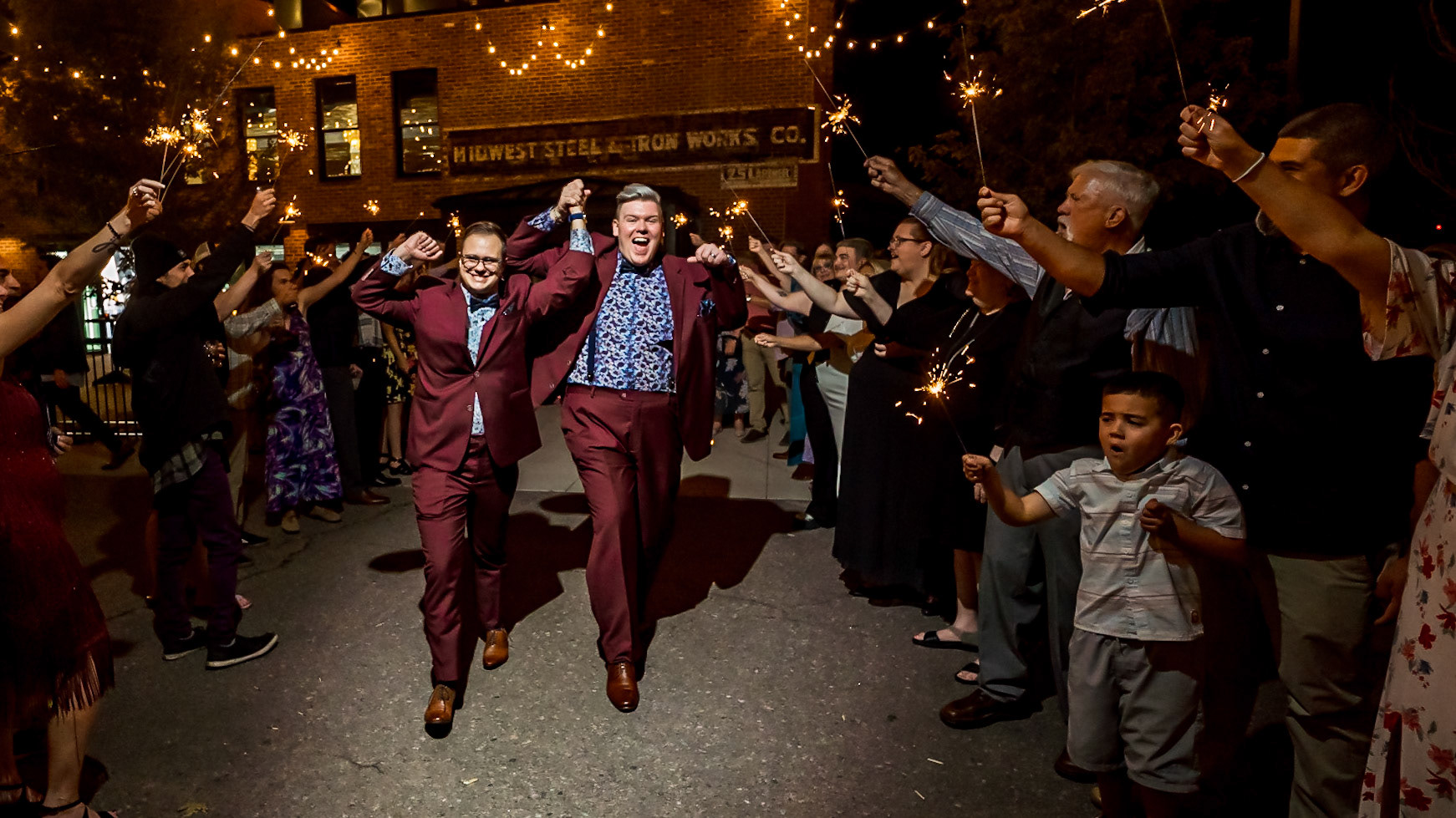 Bold, vibrant, and dramatic wedding photography at an LGBTQ+ wedding at Ironworks in Denver, Colorado