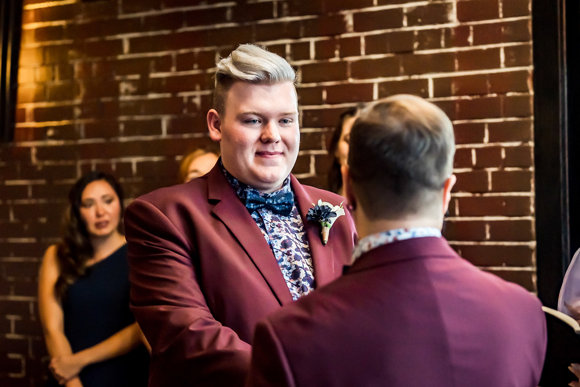 Bold, vibrant, and dramatic wedding photography at an LGBTQ+ wedding at Ironworks in Denver, Colorado