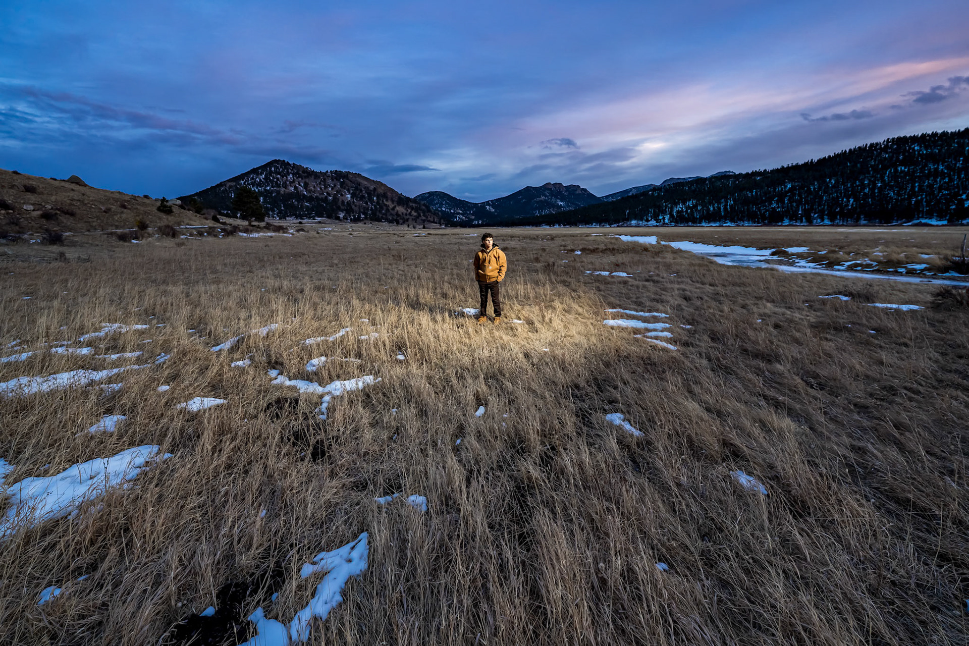 Snowy winter high school senior portraits for a young man in Rocky Mountain National Park, CO