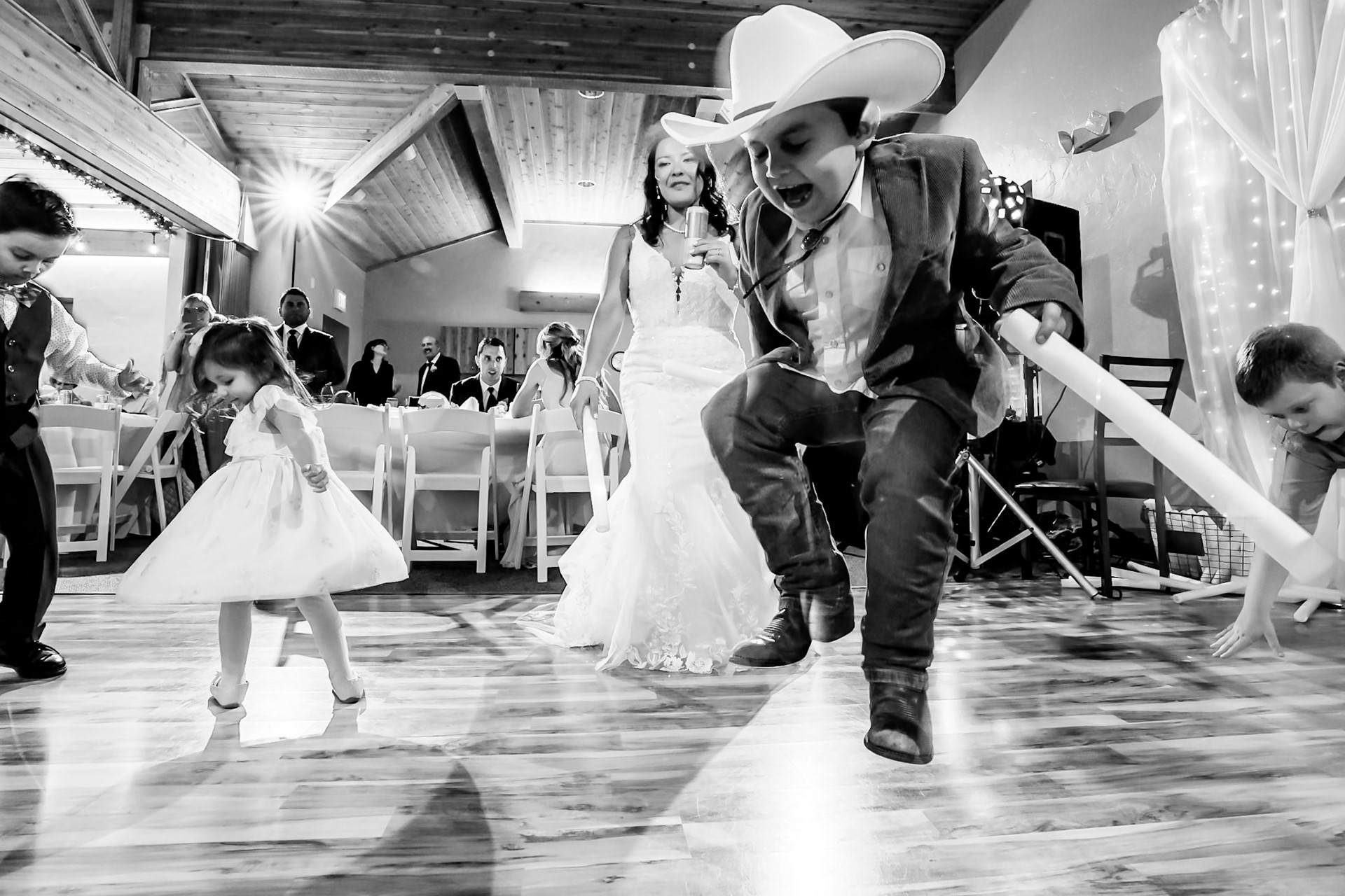 A gorgeous couple tattoos each other at their wedding at Stonehaven Event Center in Colorado Springs