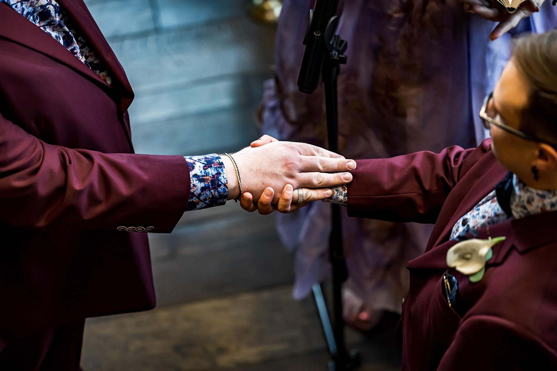 Bold, vibrant, and dramatic wedding photography at an LGBTQ+ wedding at Ironworks in Denver, Colorado