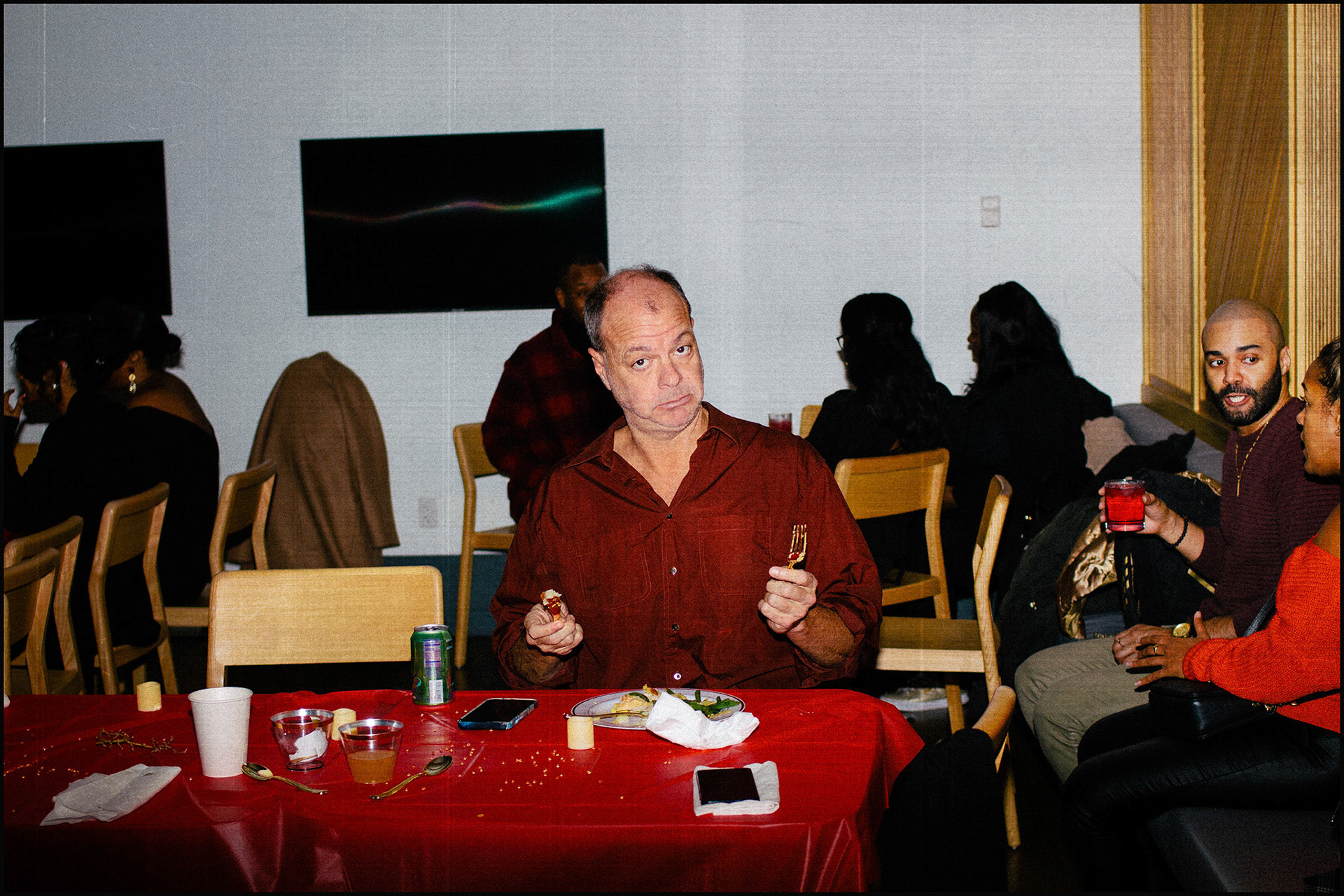 Man sitting at table in NYC photographed on 35mm film