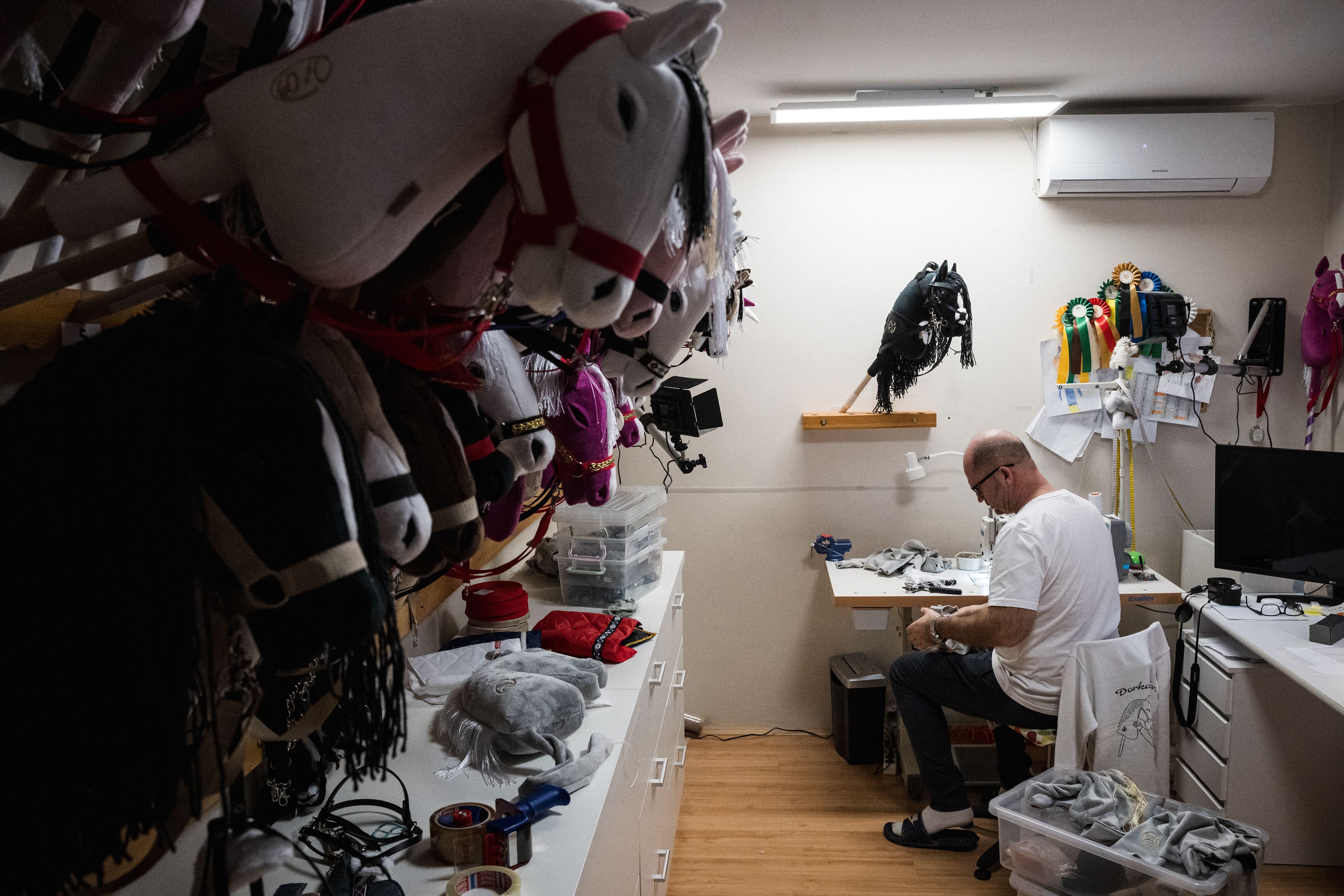 Sándor Simon's daughter Dorka made her first hobby horse at home in 2019 as a birthday gift for her middle sister. It was such a hit that the youngest immediately wanted one too. The parents supported their daughter, happy that 8-year-old Dorka was making her own horses. First using a hand sewing machine, then a larger one, the parents helped her sew the horses onto wooden sticks.    The kids played in the street, and soon more parents and grandparents came, asking for hobby horses. At first, they sewed them at material cost for villagers, but the breakthrough came in 2022 when people started contacting them online.    The family gift idea became a business, and in early 2022, the DorkaHorse webshop was launched, run by Sándor. A former sewing machine mechanic, he initially made the horses, but as demand grew, his seamstress sister joined.    In two years, they sold ~900 horses, but Sándor can only estimate.