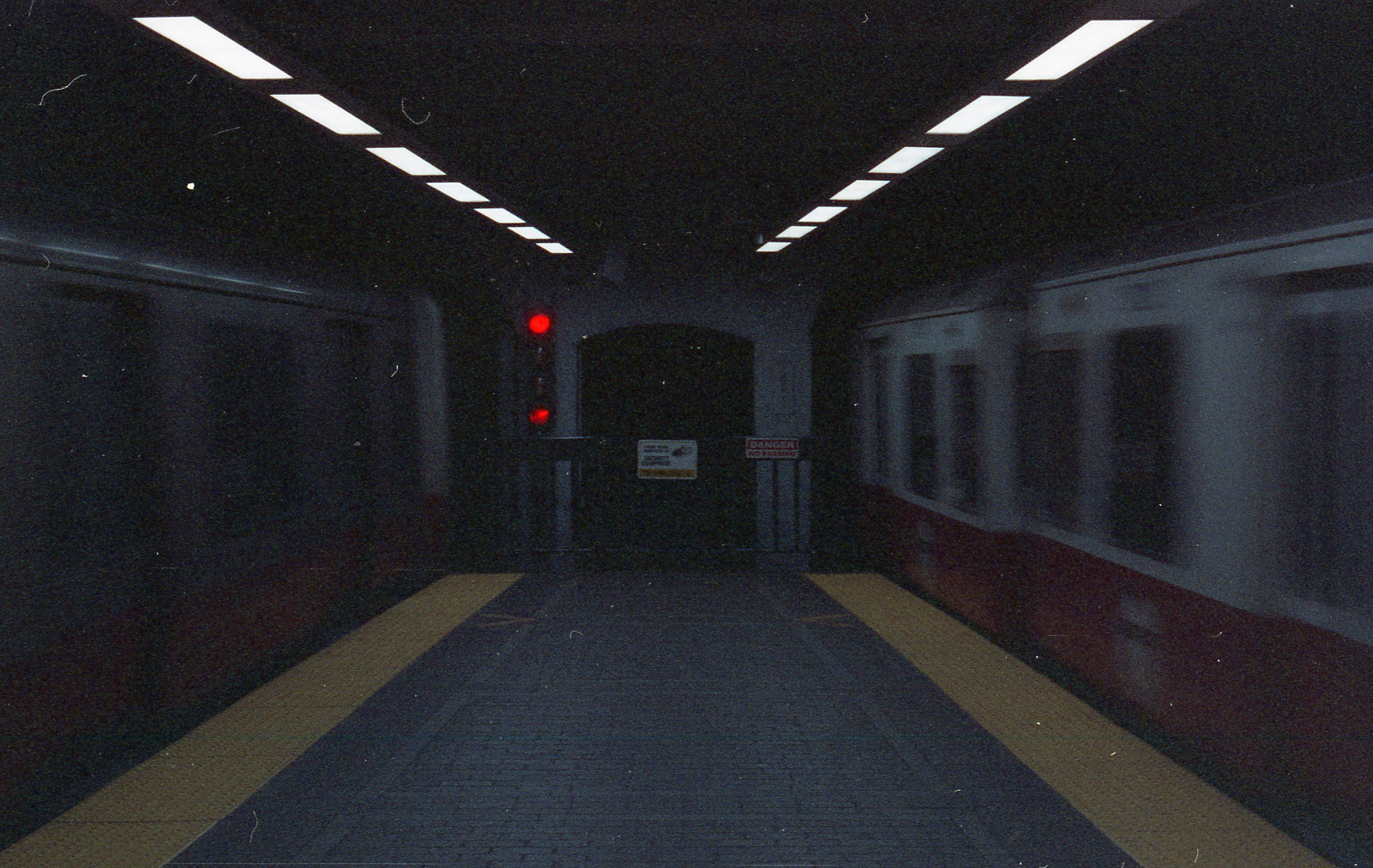 Two trains whiz by in opposite directions at Park Street.