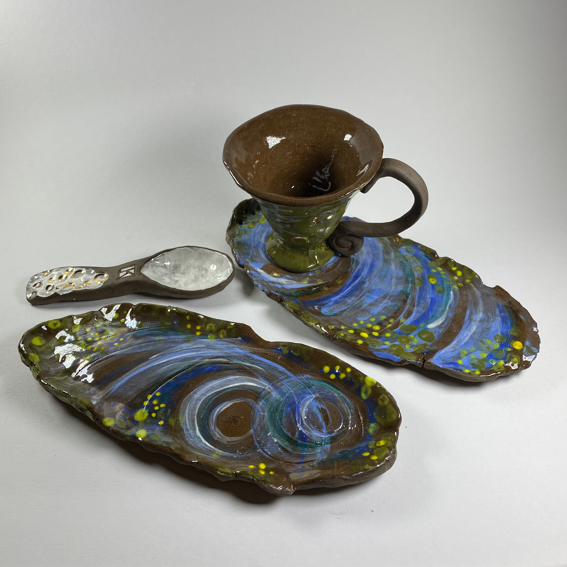 Elegant swamp teacup, saucer, and spoon