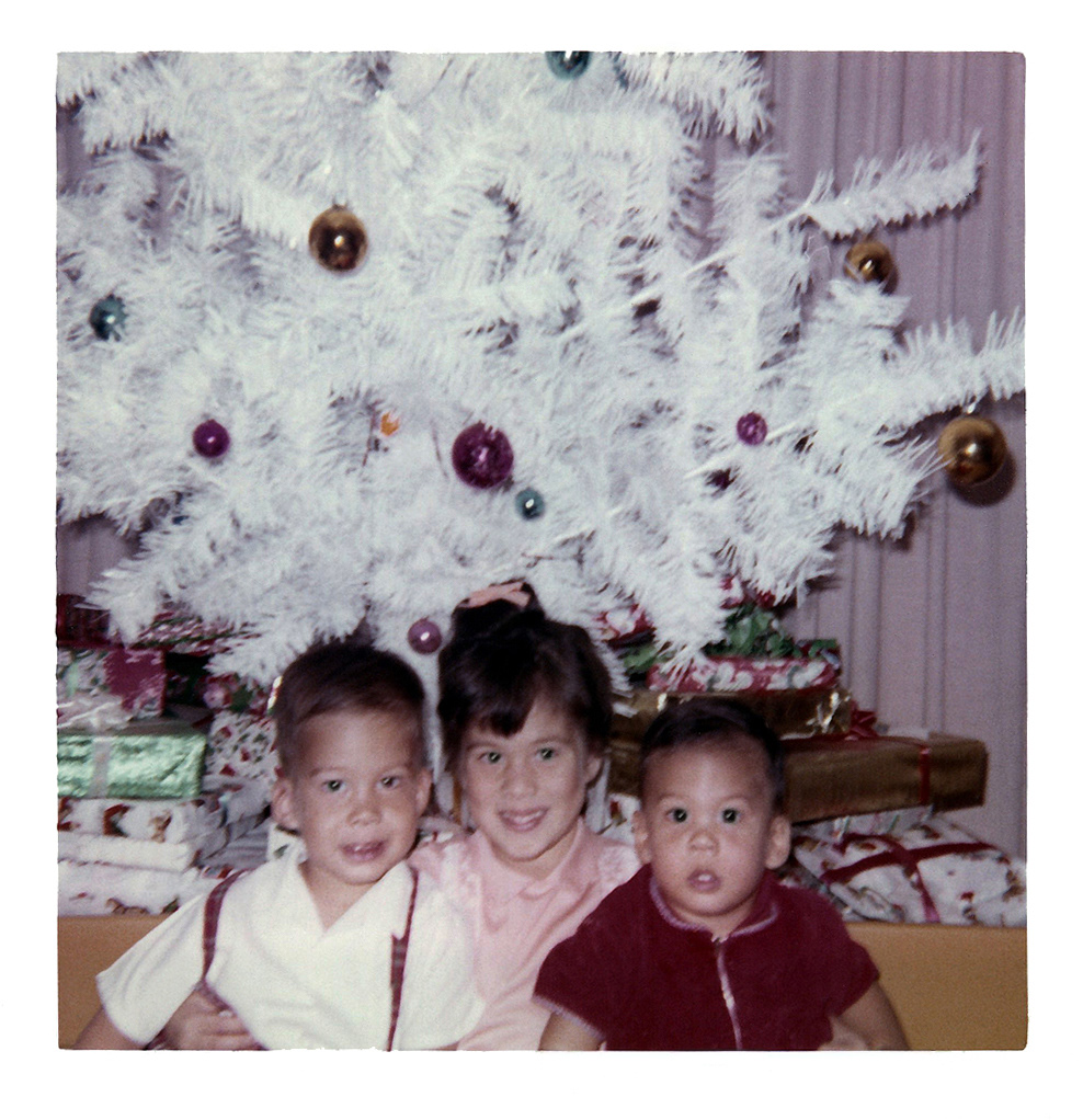 A perfect Christmas, David, Patricia, Gregory, with the familiar family white Christmas tree in the background
