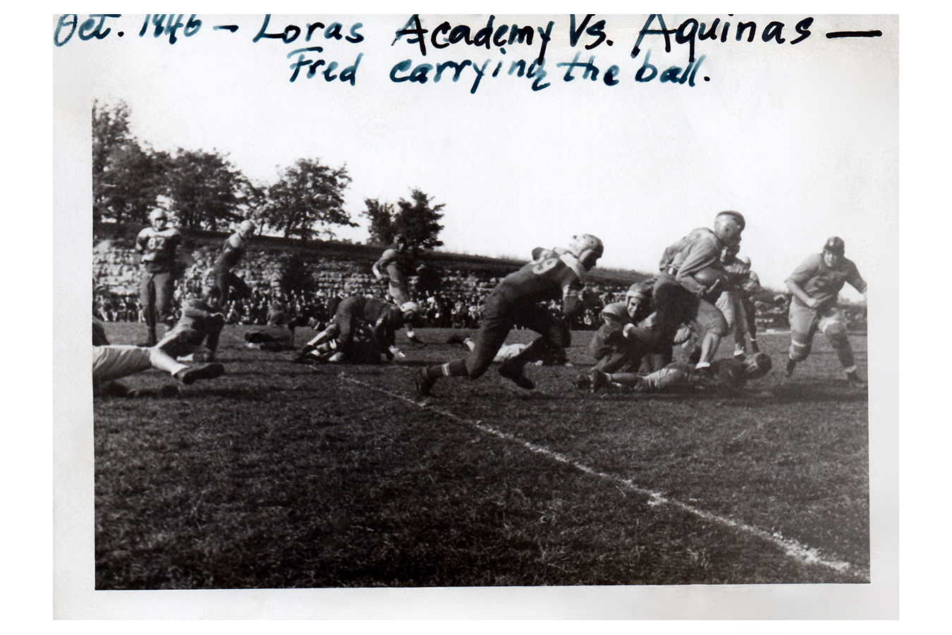 Proud father Frank records this photo of son, Fred, carrying the ball, 1946