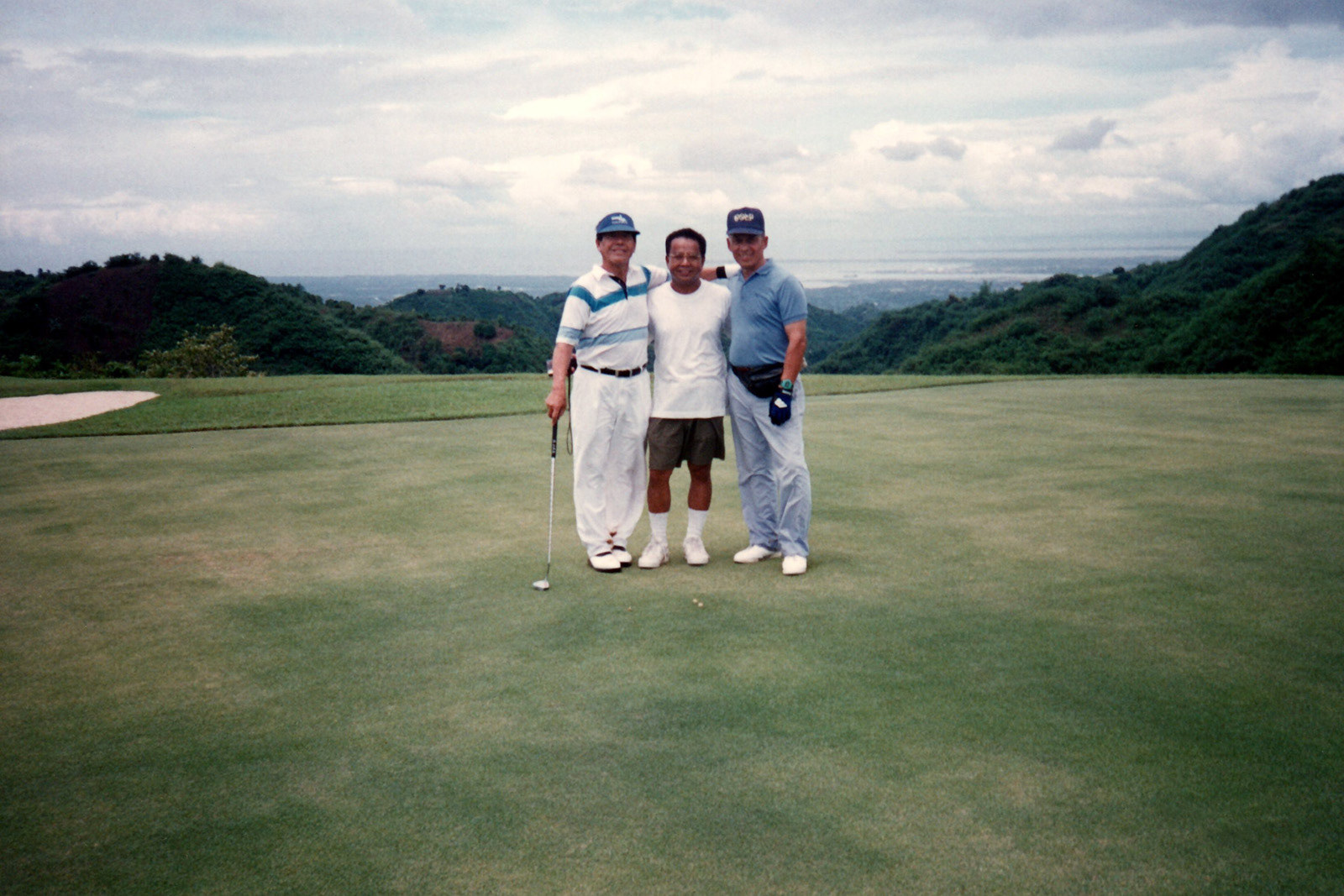 Fred (right) and friends playing golf at the Kang-Irag Golf Course, Cebu City, Philippines, 1995