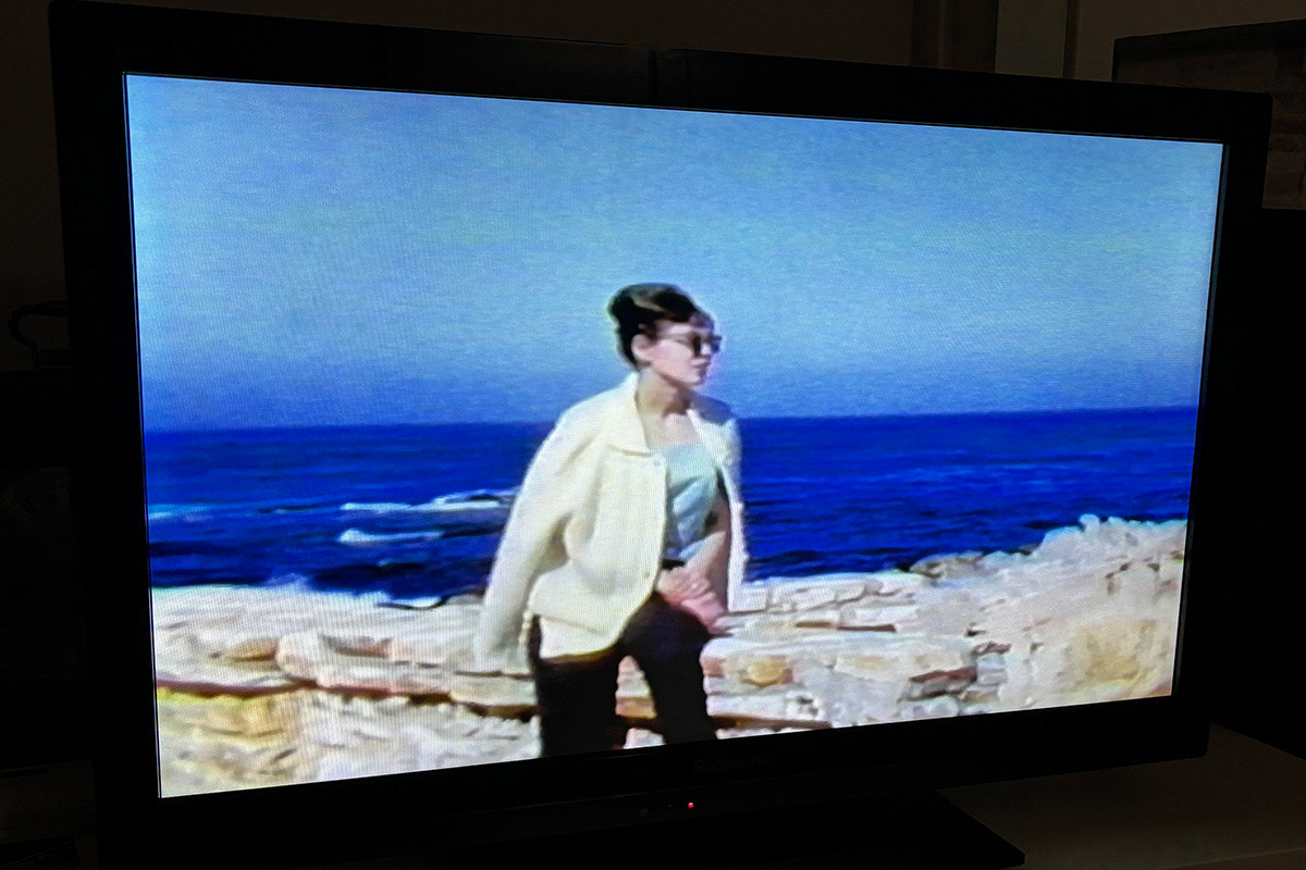 Nita poses in beautiful Carmel-by-the-Sea, California on a special trip with Fred, early 1960's (Photo taken from a VHS tape)