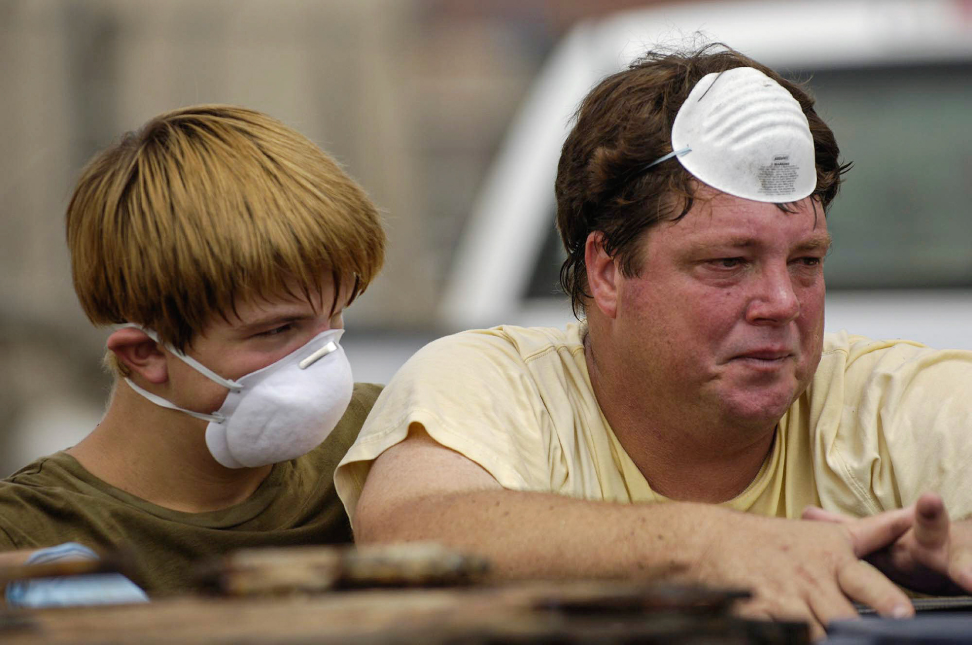 In St. Bernard Parish’s Arabi neighborhood Raymond Buasso, Jr., left, consoles his father, Raymond Buasso, Sr.  All six Buasso children and their mother lost their homes in St. Bernard Parish.