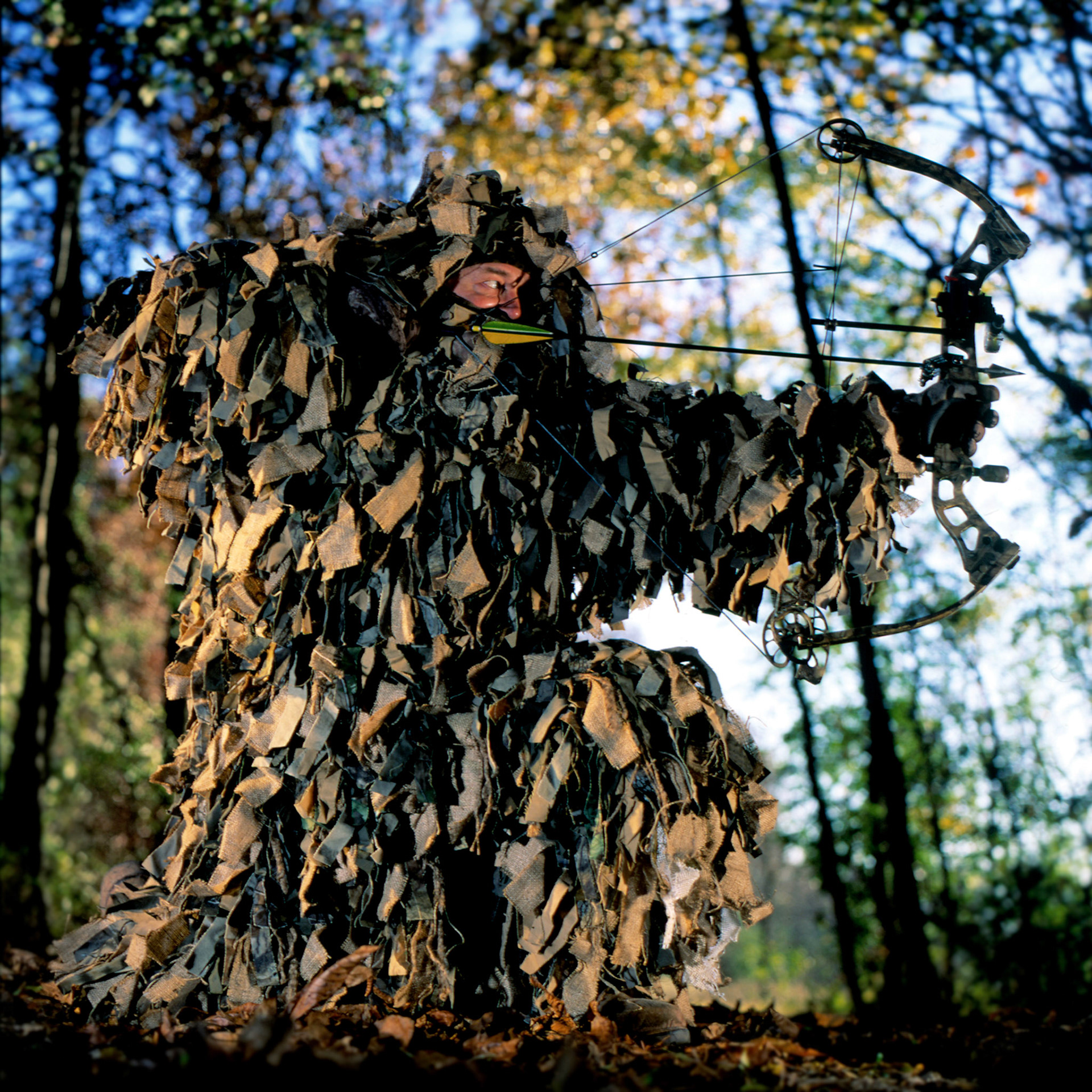 Bow hunter Dan Small poses at a Wisconsin game reserve and hunt club wearing a Gillie Suit. (ChicagoTribune)