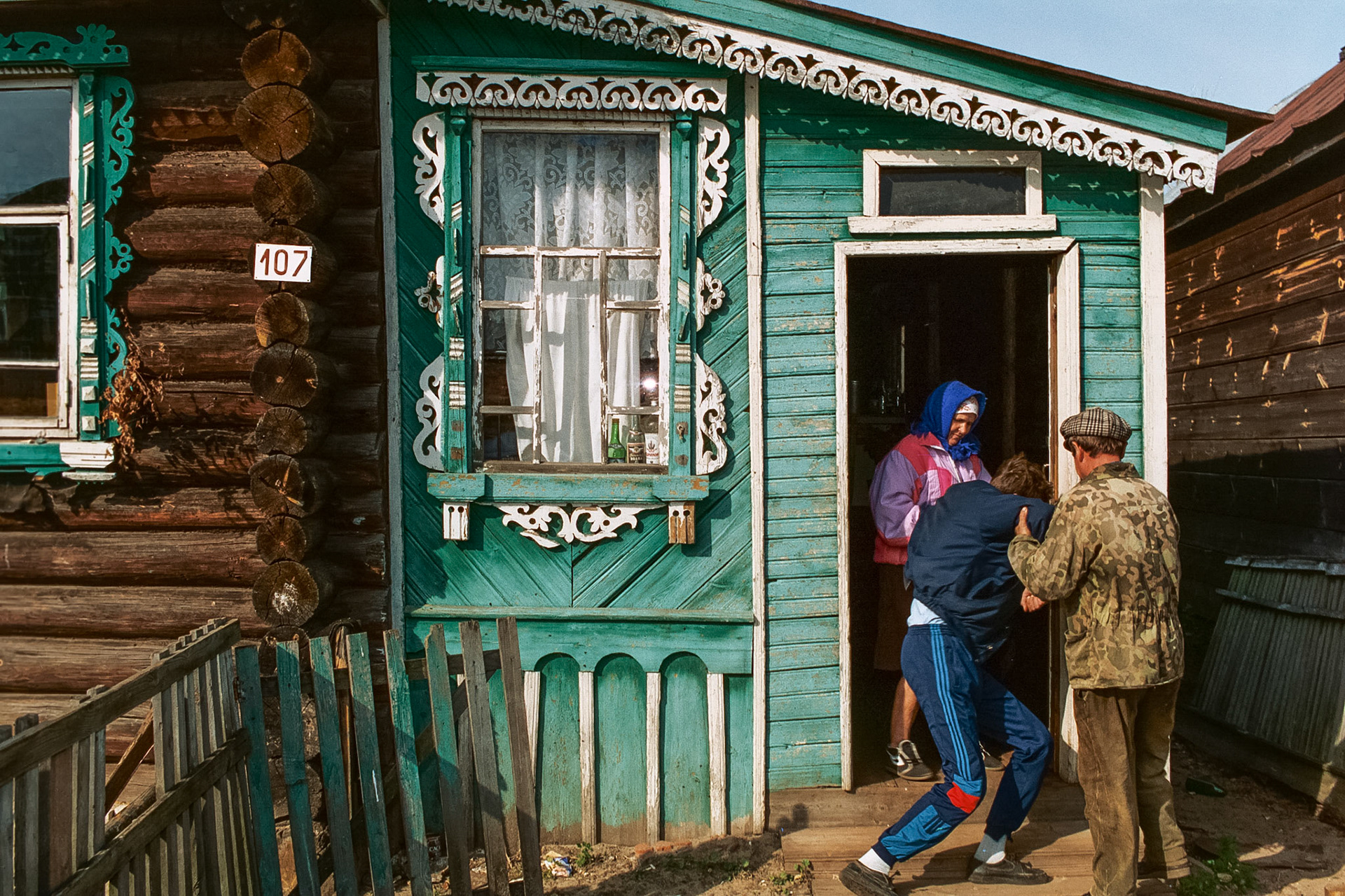 An intoxicated family member helped into his cottage in Nizhny Novgorod.