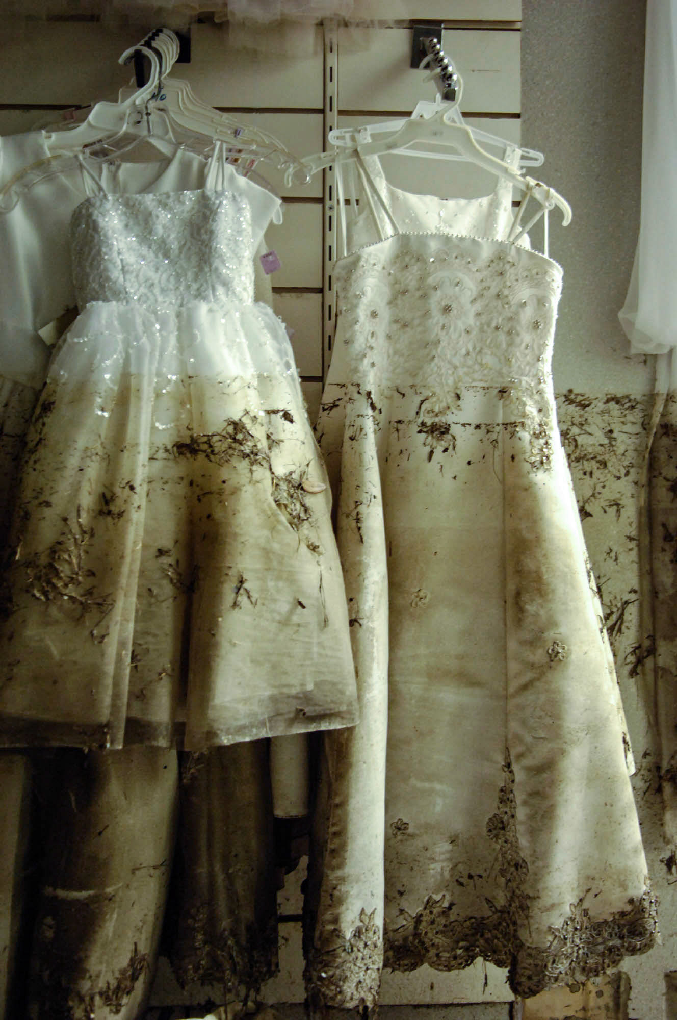 At The Plaza, a mall in New Orleans East neighborhood, interiors show  a dark, muddy mall after the waters receded.