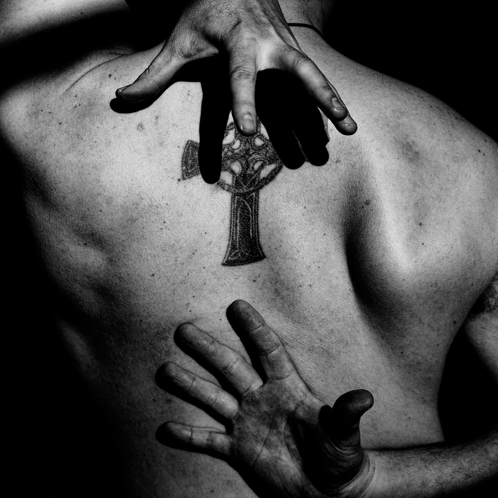 This mark is not my faith, but it holds my rage. I claw at it, peeling back the seal, daring the demons inside to face the light.