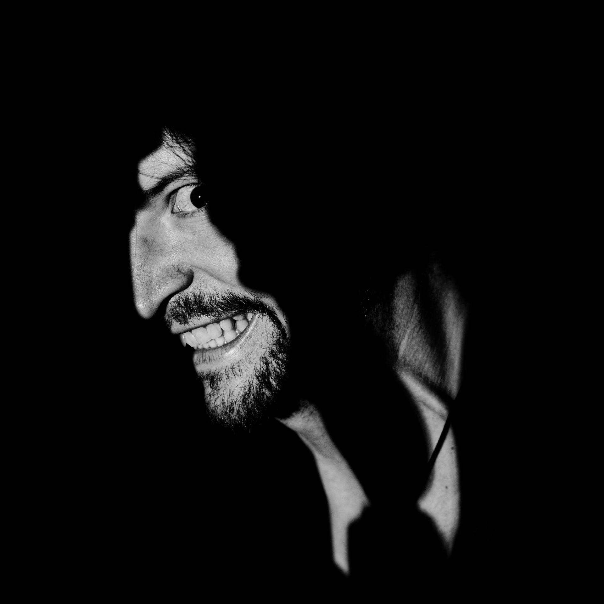 The light shows a man—what’s left of him. But he’s already gone. Grief won this battle. Now, it emerges from the dark.