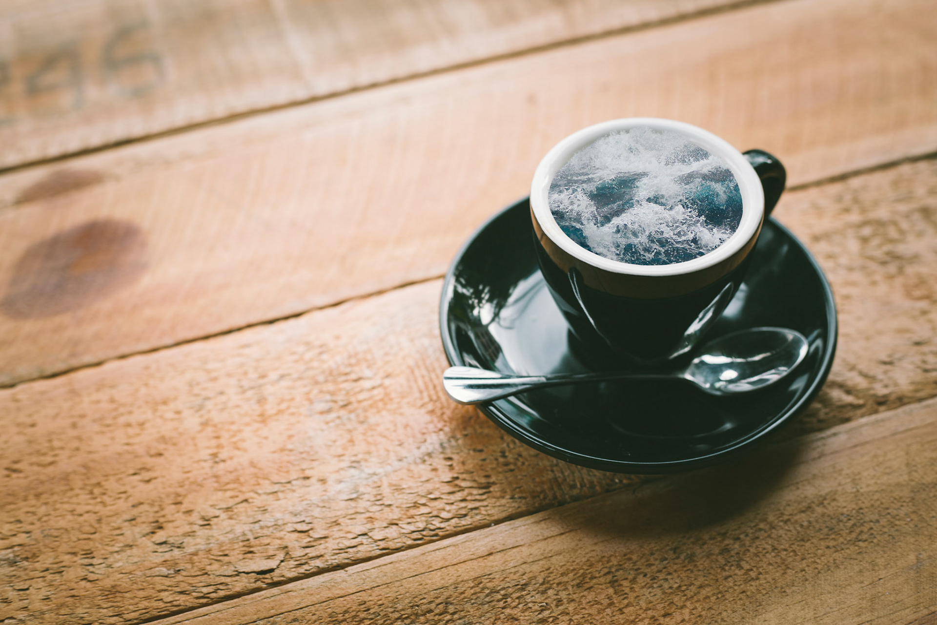 hot espresso in wood table background. hot coffee in coffee shop