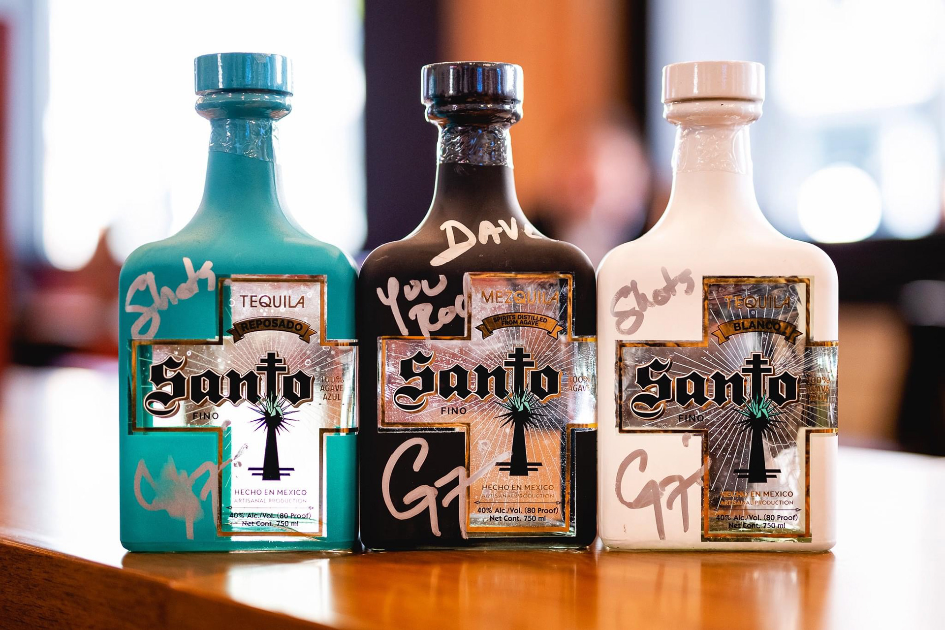 Bottles of Santo Tequila signed by co-founder Guy Fieri