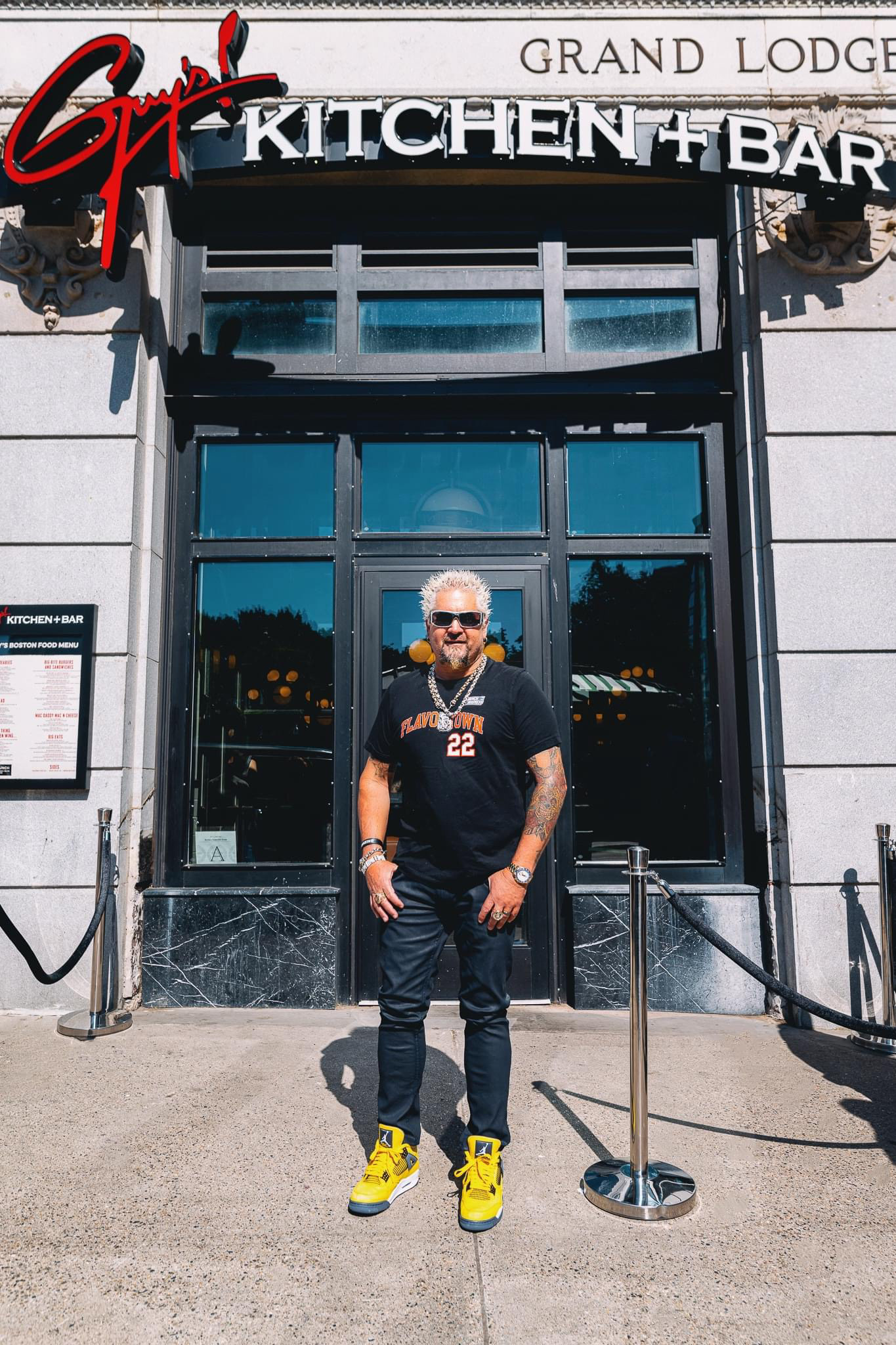 Guy Fieri standing outside his newest Boston restaurant location