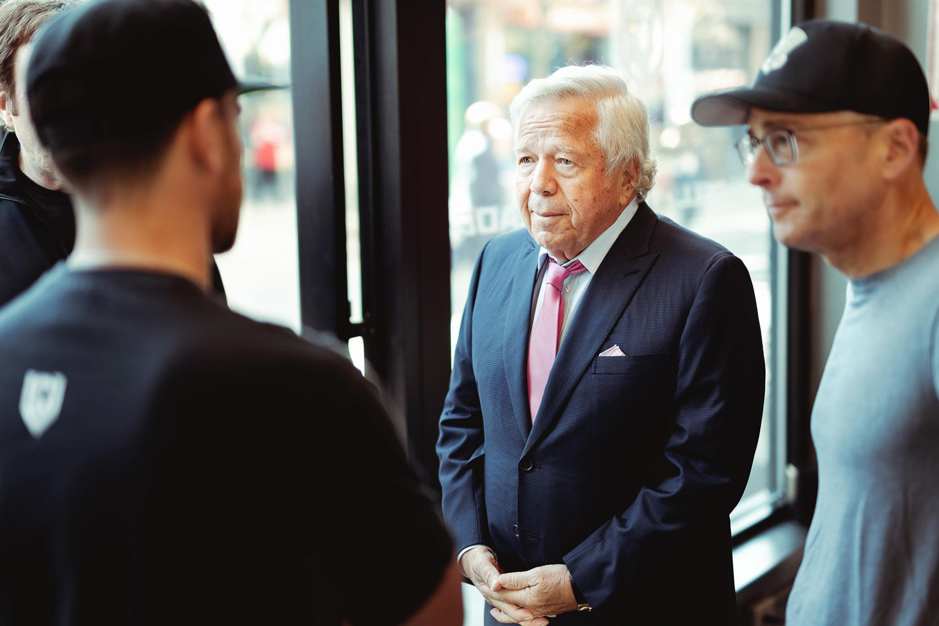 Robert Kraft attending the grand opening of a new business at Patriot Place