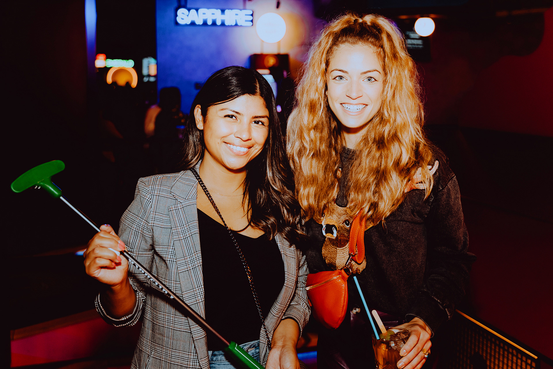 Two local influencers at Puttshack Boston's grand opening