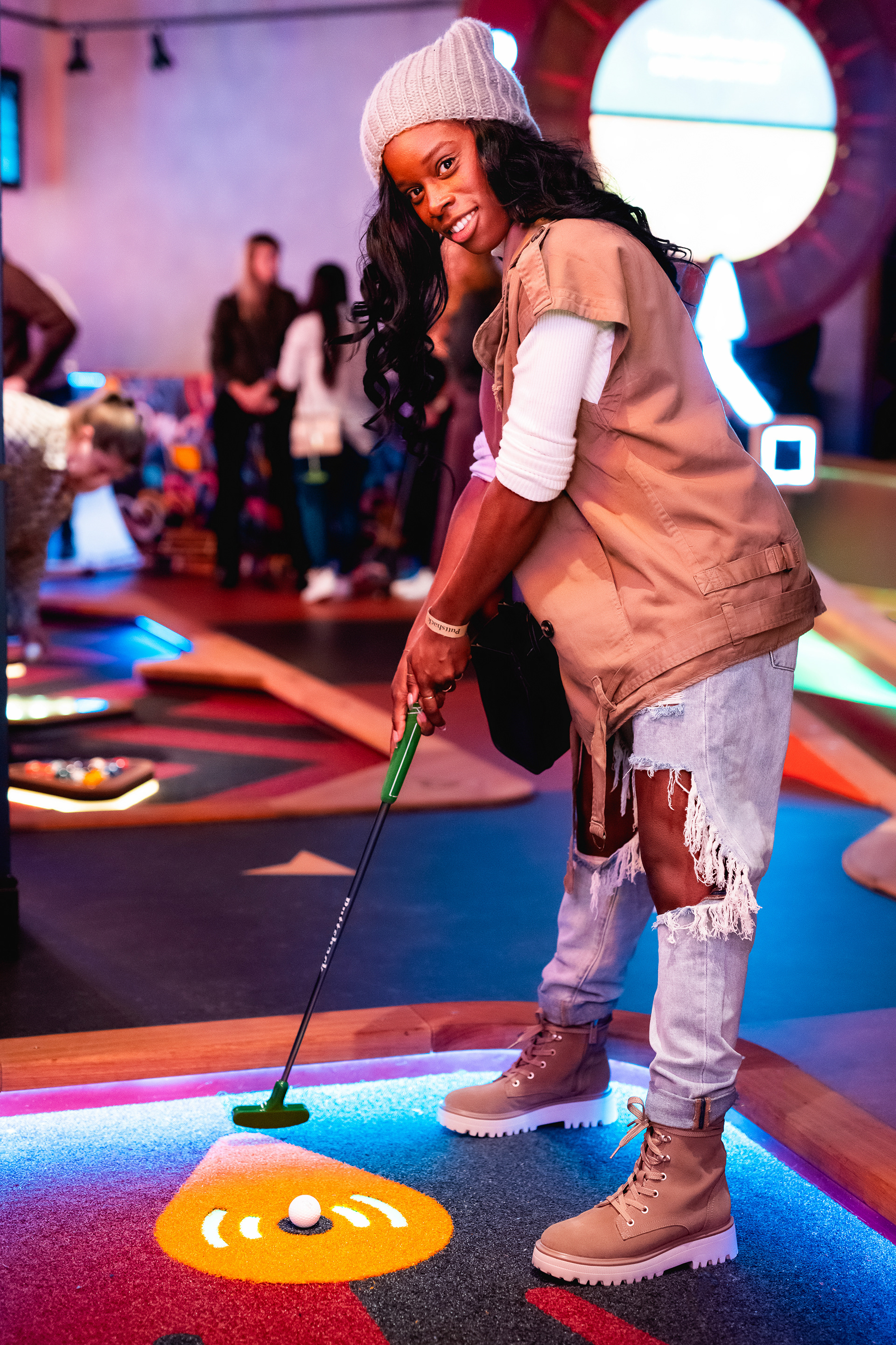 Local influencer plays golf at Puttshack Boston's grand opening