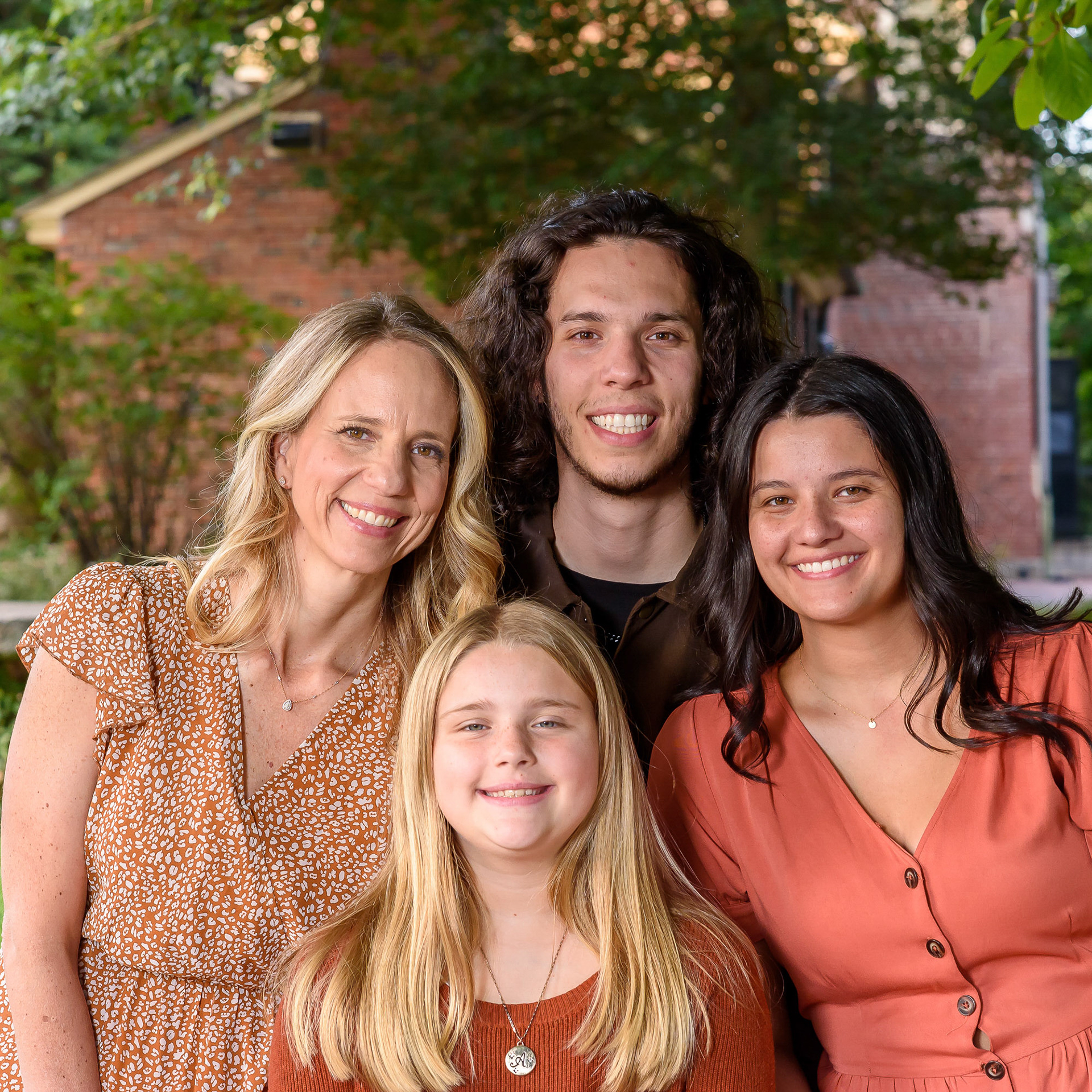 Children with mom in a group photo in a park