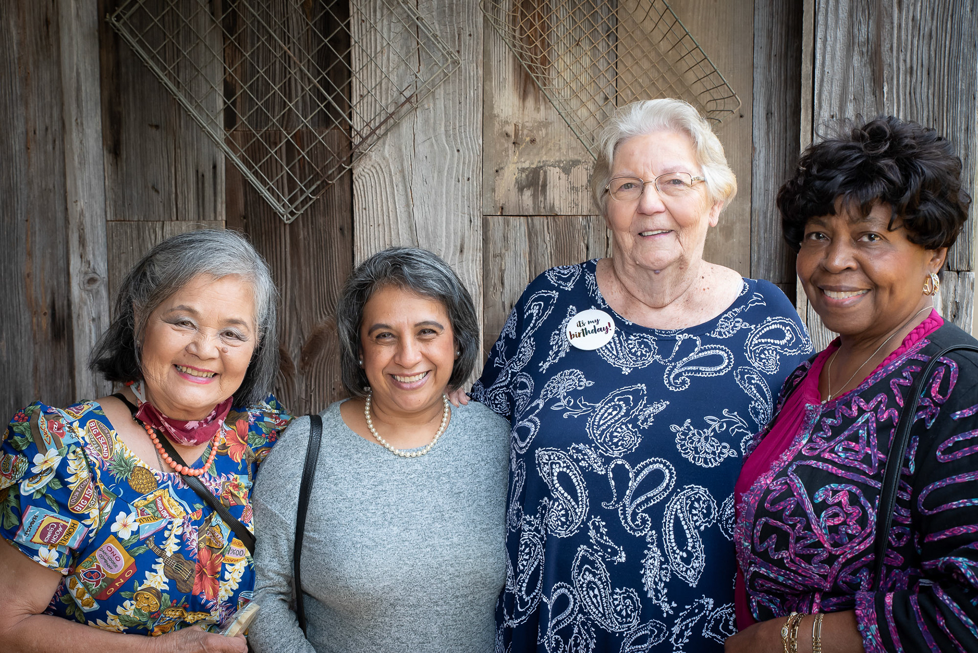 Four mature woman in a group photo