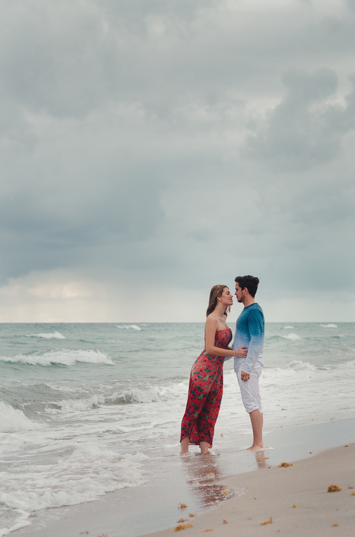 Couple portrait at Dania Beach with dramatic sky