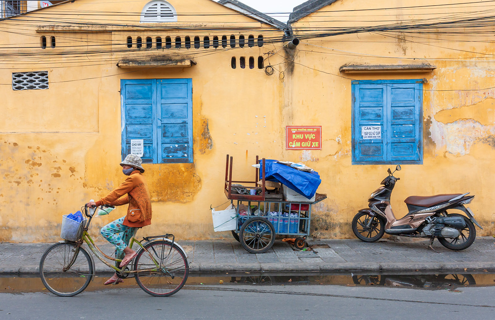 Woman on bike in Hoi An