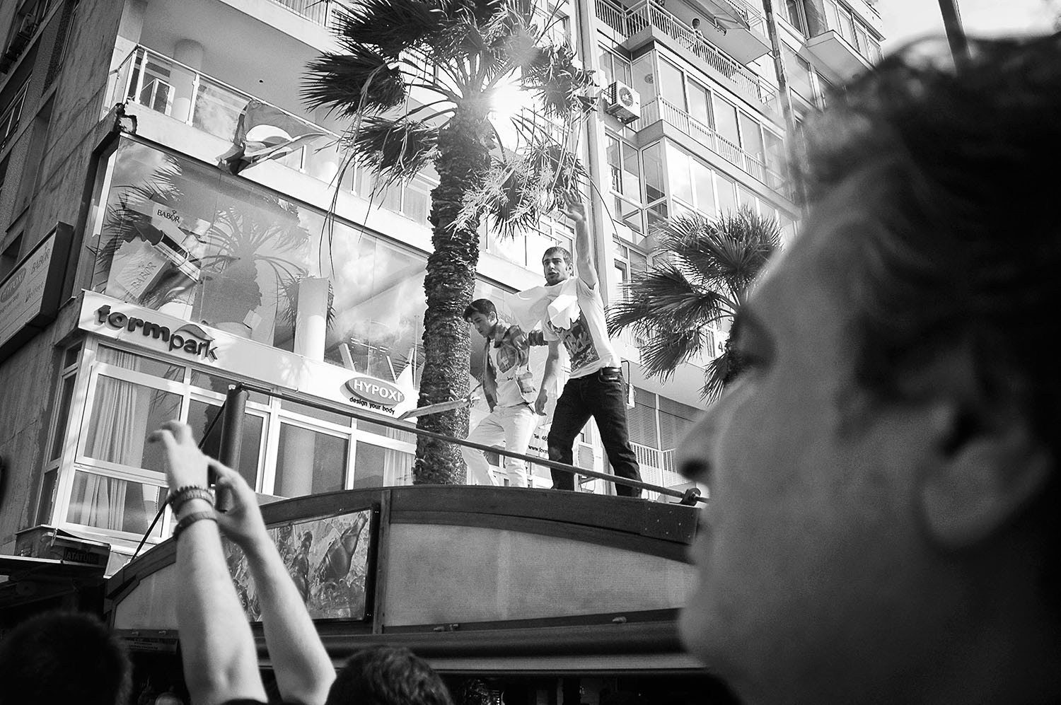 Protesters watching the approaching riot police.