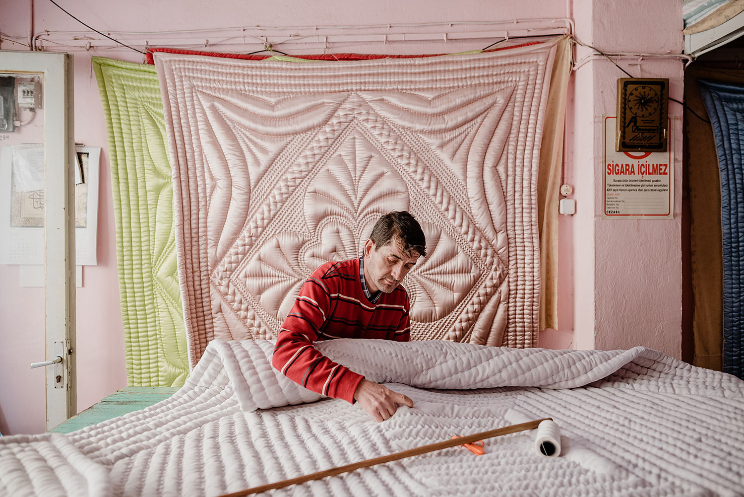 A quilt maker or yorgancı as they are called in Turkish producing a large piece of quilt.