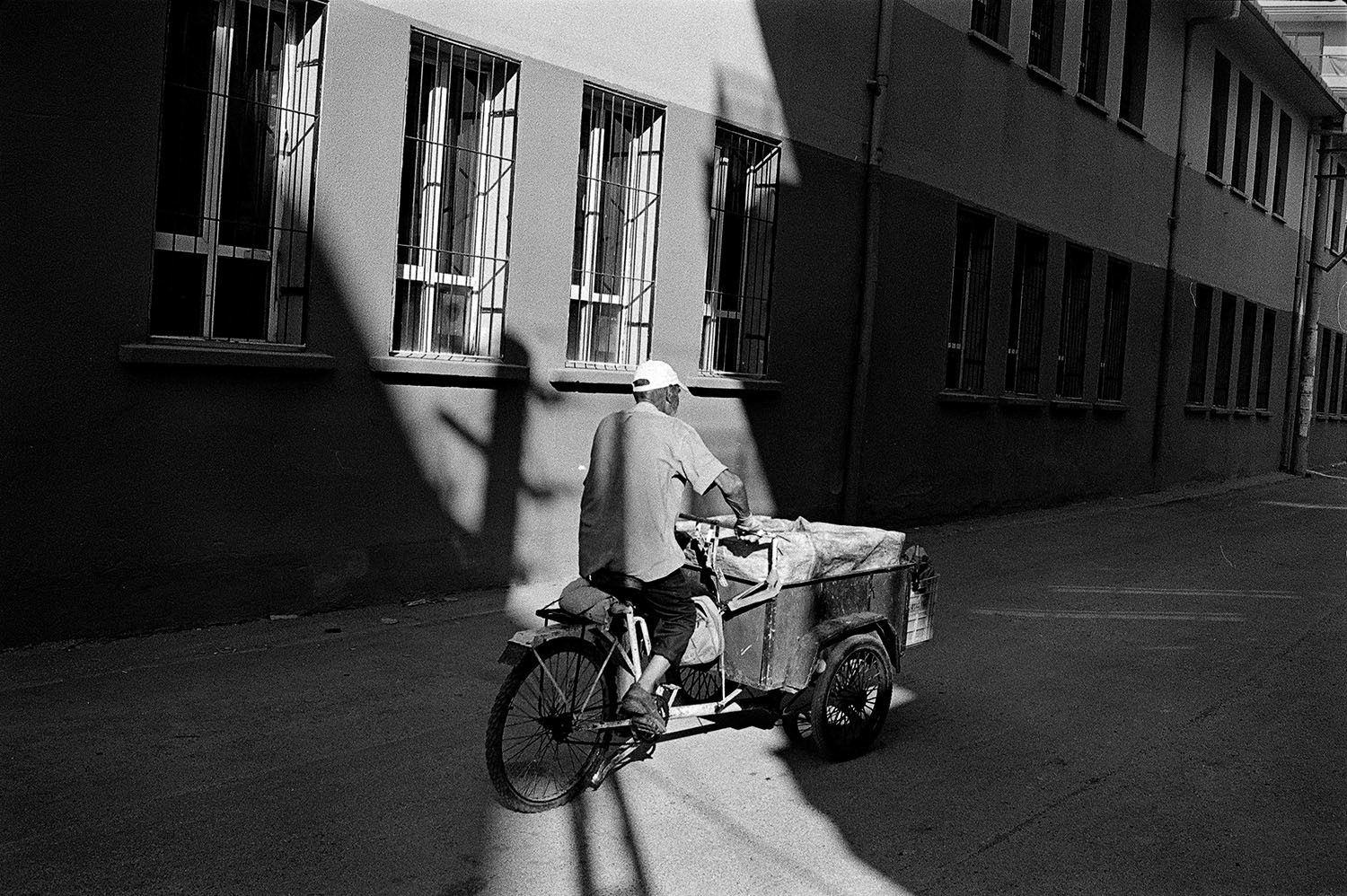 A garbage collector riding his cart on the streets of Şemikler District in Karşıyaka, İzmir, Turkey.
