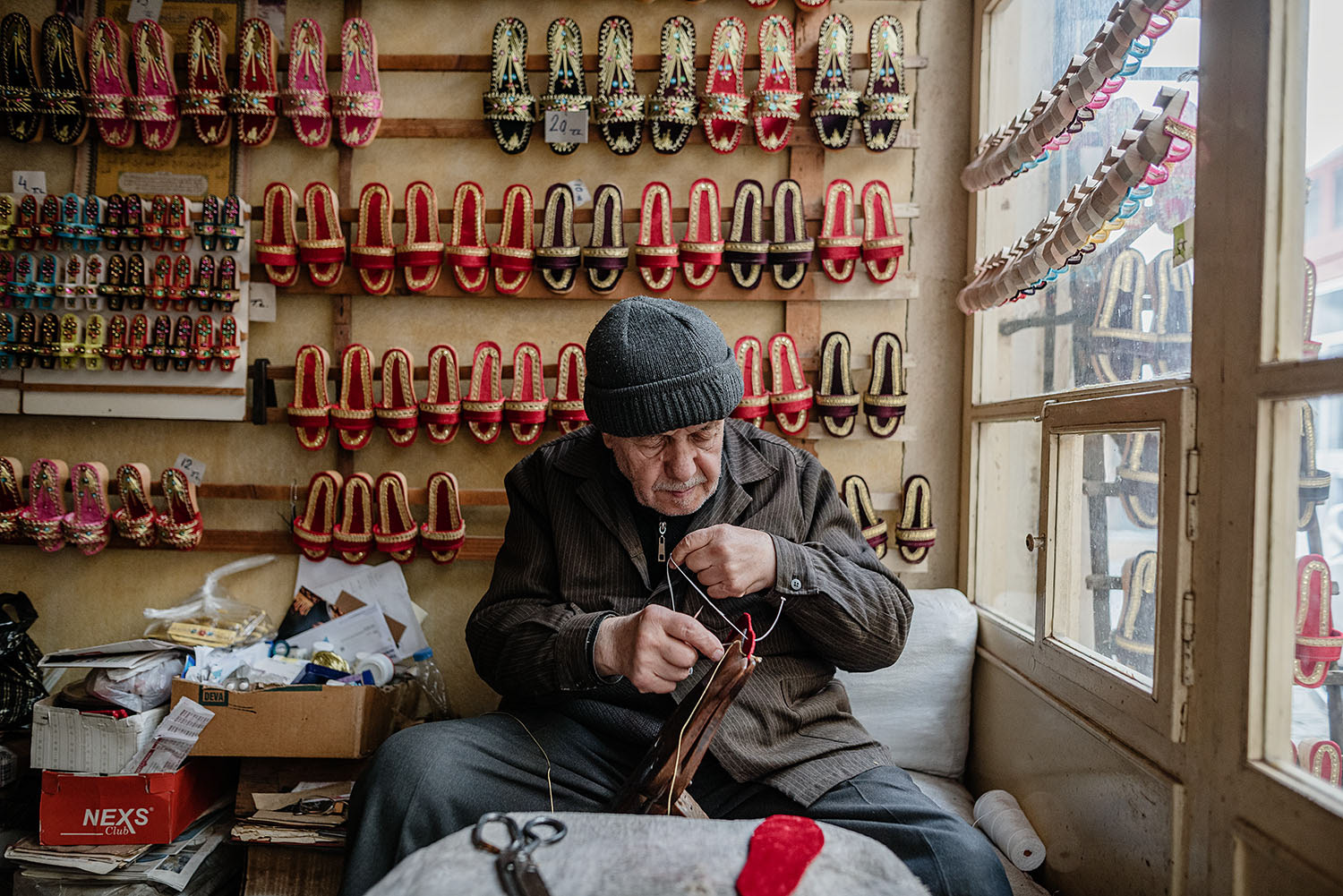 Cemil Tolga, a 90 year old wooden clog maker working on a clog shoe.