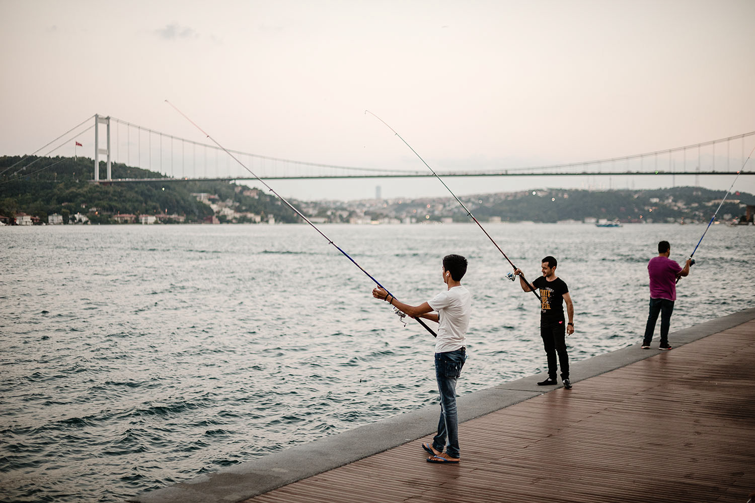People fishing along the Bosporus in İstanbul. 
