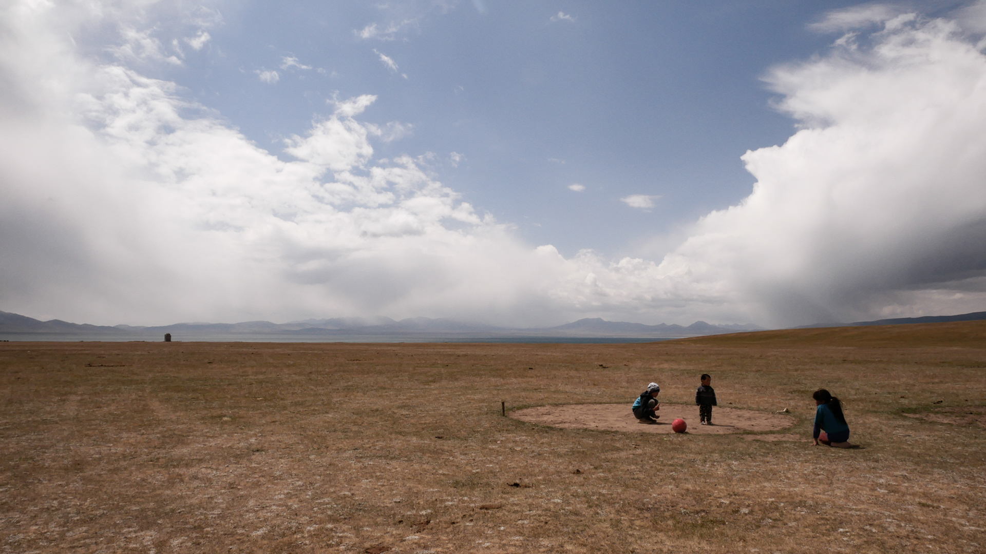 Kids playing near the Song Kol Lake