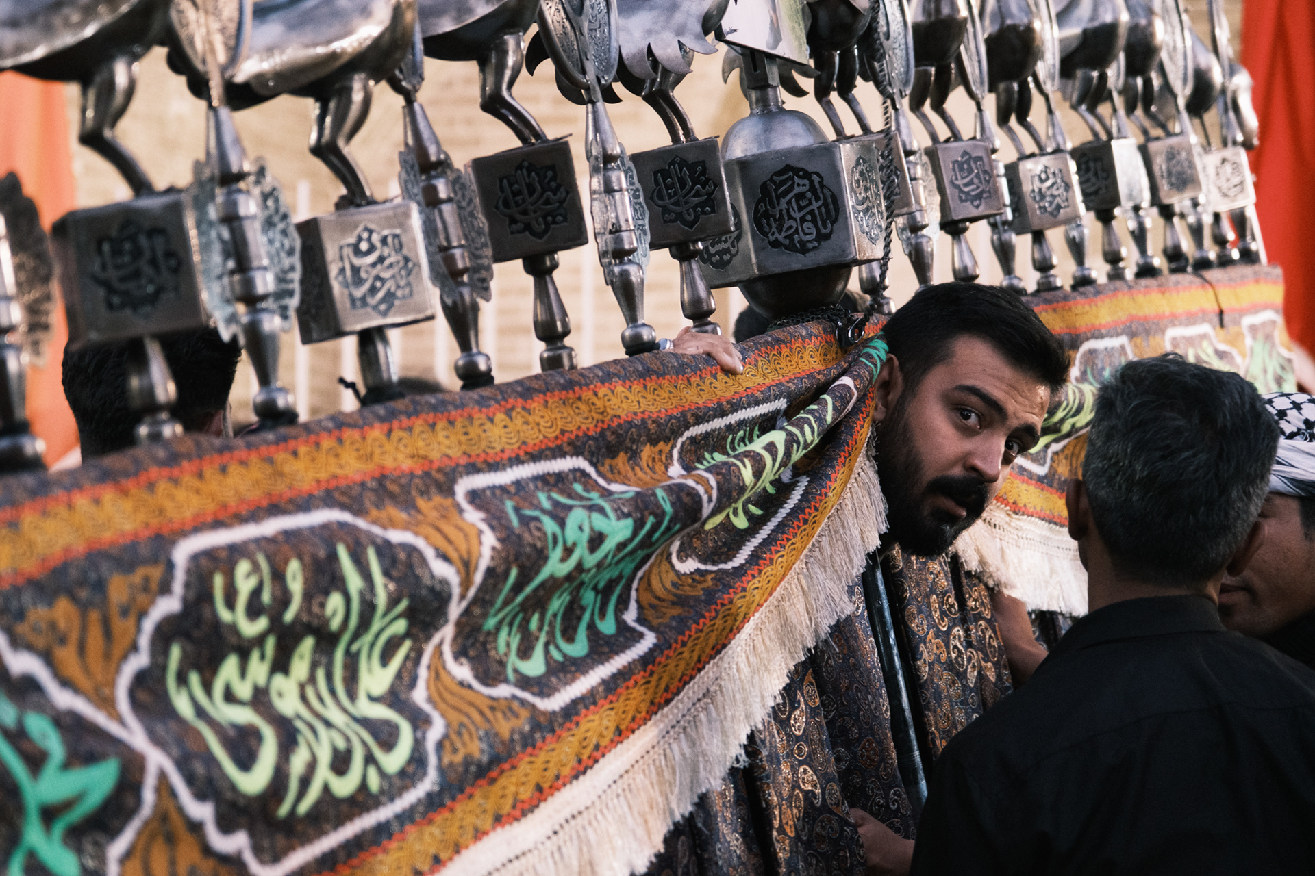 A Man lifting "Alam"