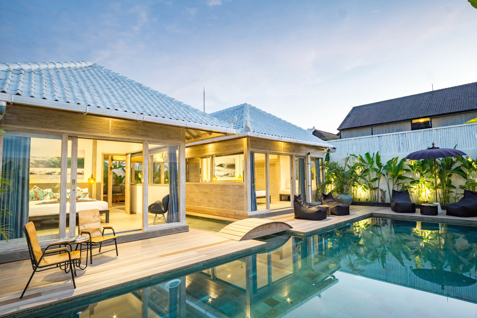 A beautiful wooden villa feels very clean and warm. It overlooks the sunset makes it look gold-ish.