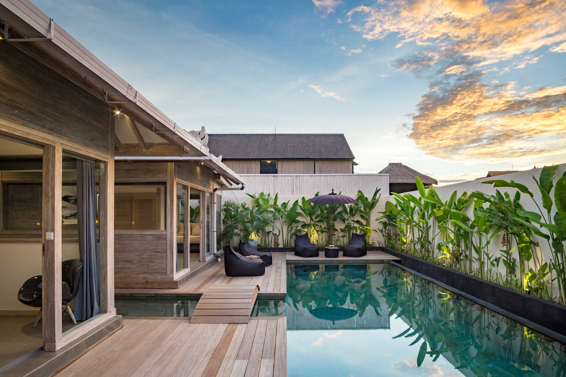 A beautiful wooden villa feels very clean and warm. It overlooks the sunset makes it look gold-ish.