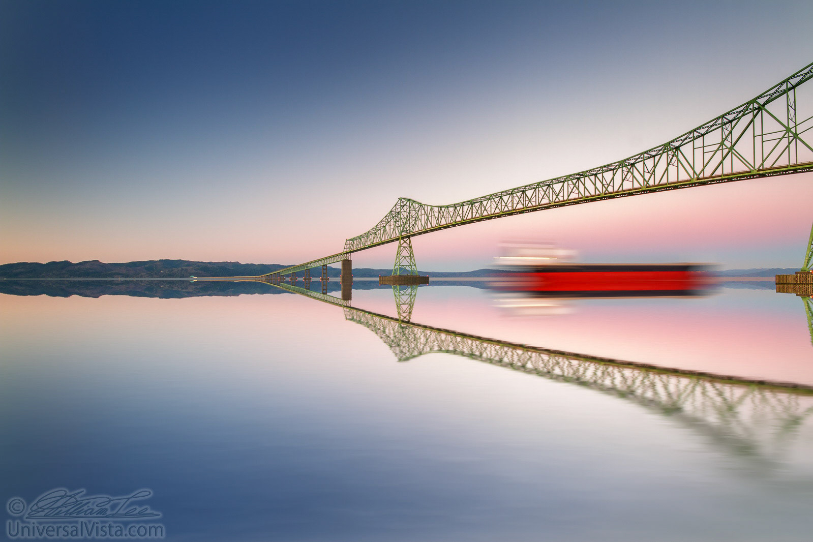 A fine art image of a very long bridge and a ship in clear twilight sky