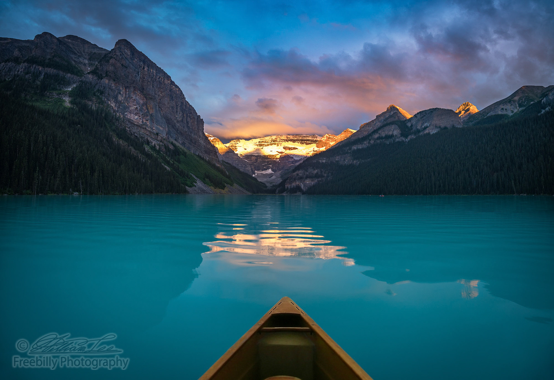 It's quite an awesome experience to wake up early and enjoy the Lake Louise sunrise from inside a canoe.