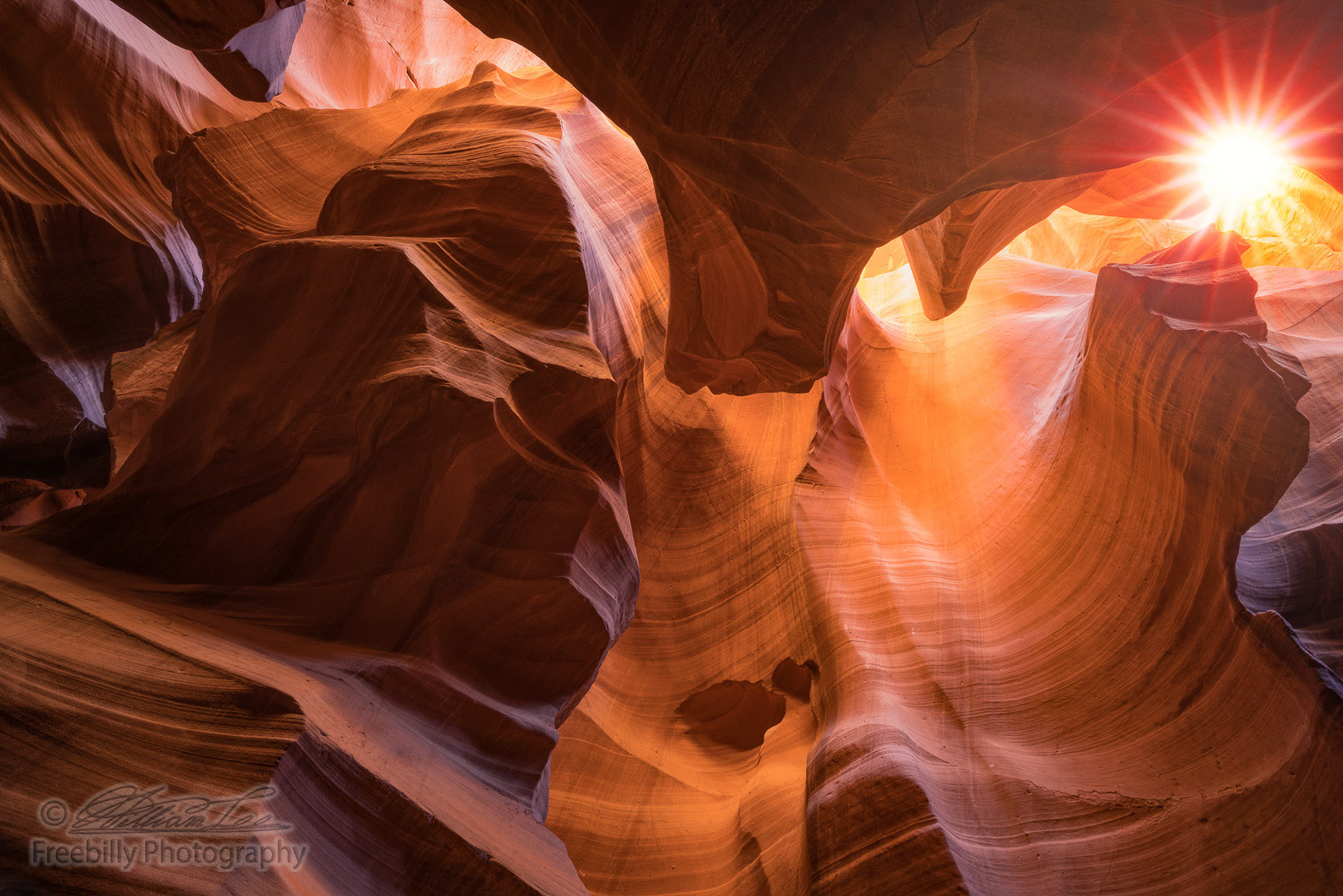 This is a photograph of the Antelope Canyon with sunburst.