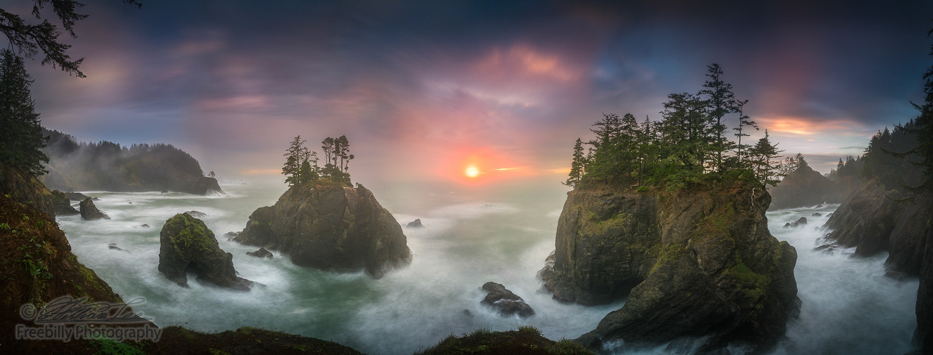 This is a photograph of big sea stacks with trees of Oregon coast taken at sunset hour.