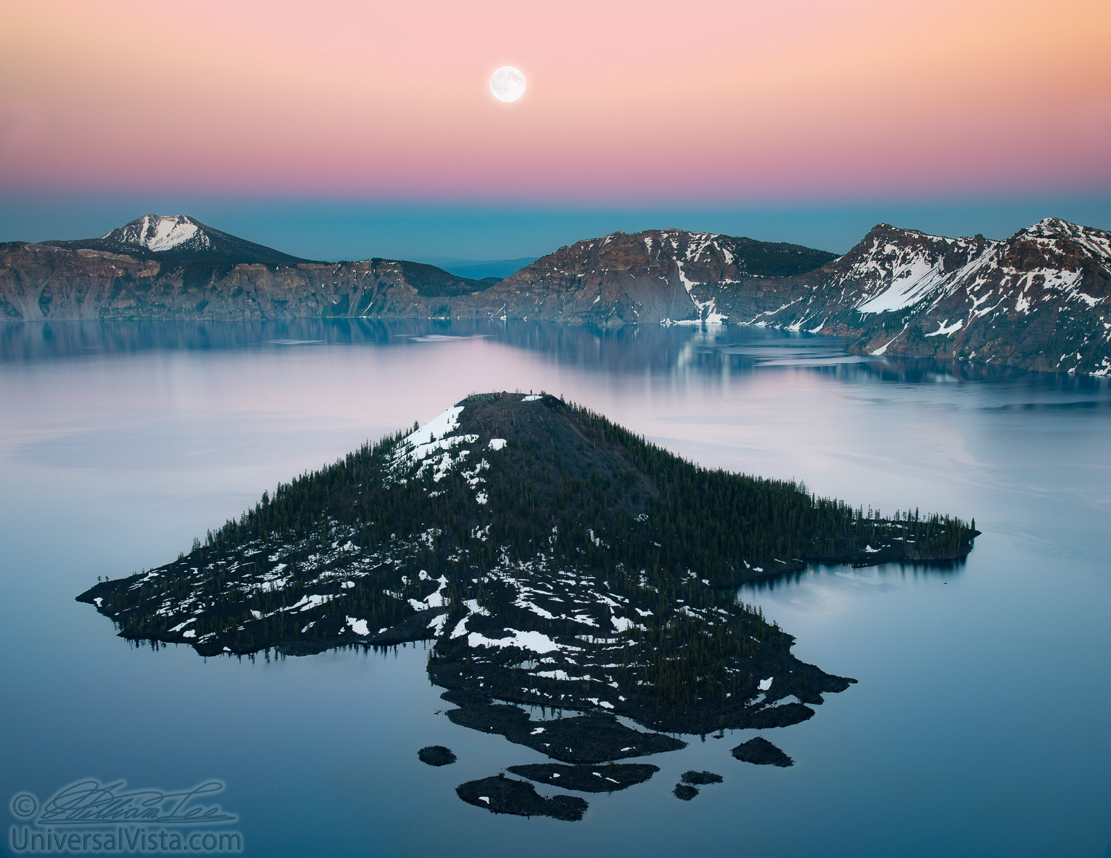 This is a photograph of Wizard Island and full moon at sunset hour