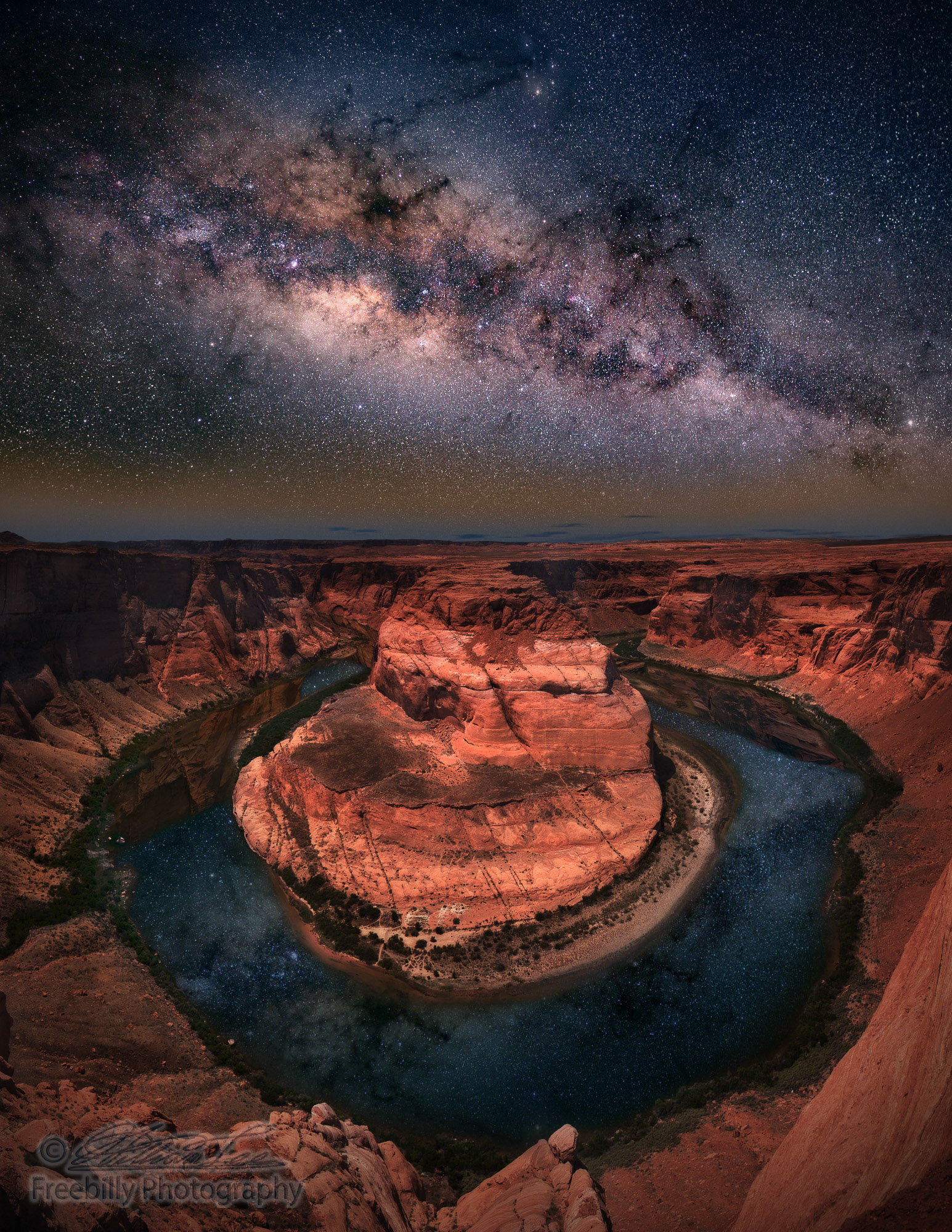 A panoramic photo of Horseshoe bend with milkyway.