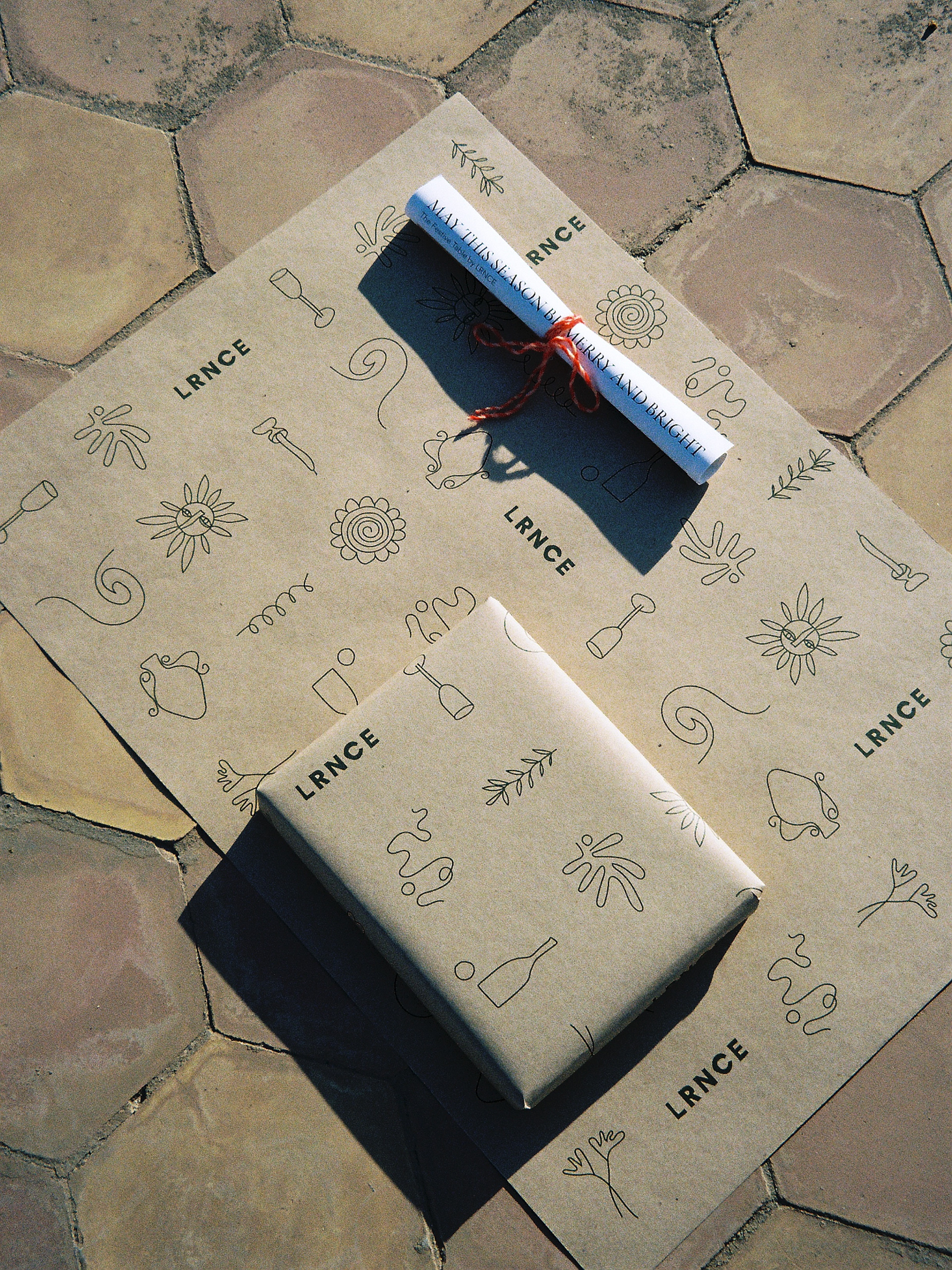 Christmas wrapping with new design representing recurrent elements in LRNCE’s designs