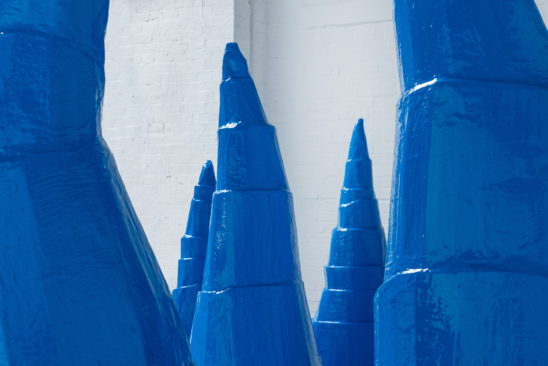 Installation shot - 'Untitled (Blue cones)', 2024 (cardboard, acrylic, resin)