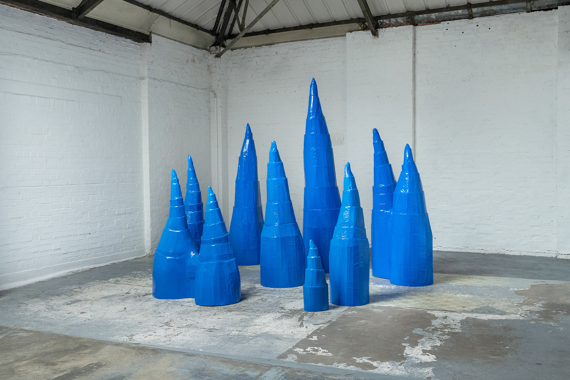 Installation shot - 'Untitled (Blue cones)', 2024 (cardboard, acrylic, resin)