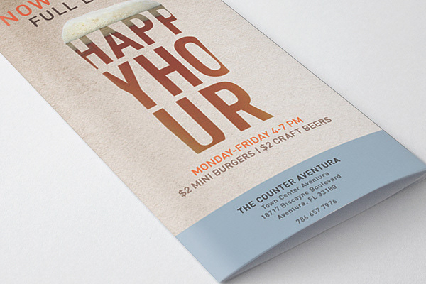 A small printed handout flyer. I designed the custom typography seen in the glass bottle design.
